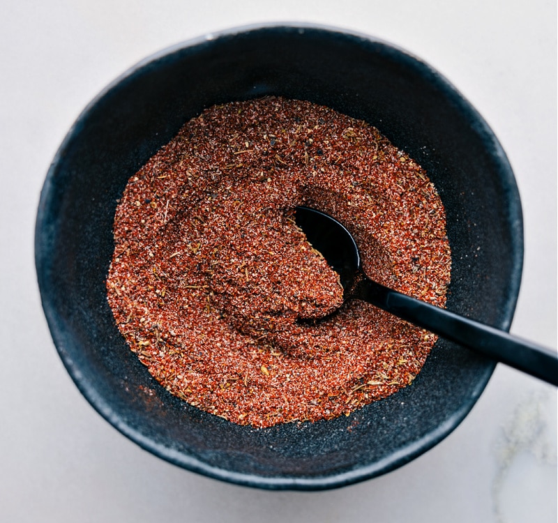 Blackening Seasoning recipe! Easily homemade, it combines everyday spices and can be stored for future use, bringing a robust flavor to meats, fish, and vegetables. Recipe via chelseasmessyapron #spice #seasonings #quick #easy #simple #grilling #blackening #seasoning Spice mix all combined in a bowl.