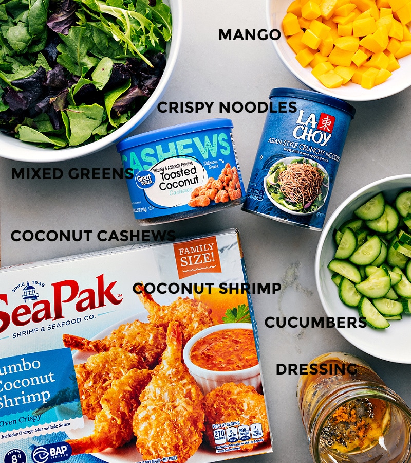 Coconut Shrimp Salad is as delicious as it is easy. It's a burst of tropical bliss and couldn't be quicker to make! Recipe via ChelseasMessyApron.com #shrimp #crispy #chowmeinnoodles #mango #clementines #salad #quick #easy #backtoschool Ingredient shot: All the elements of Coconut Shrimp Salad