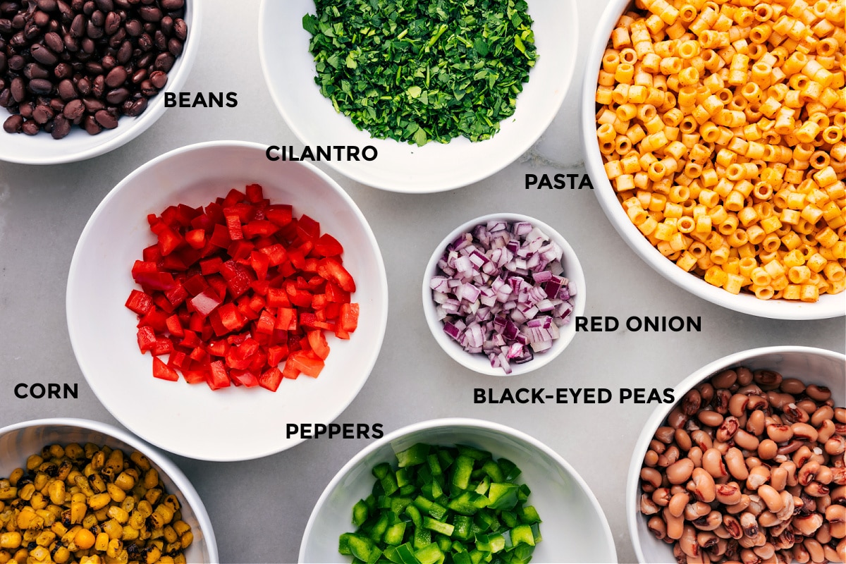 Ingredients In Cowboy Caviar Pasta Salad All the ingredients for this recipe are prepped and ready for easy assembly, including beans, cilantro, pasta, onions, and peppers.