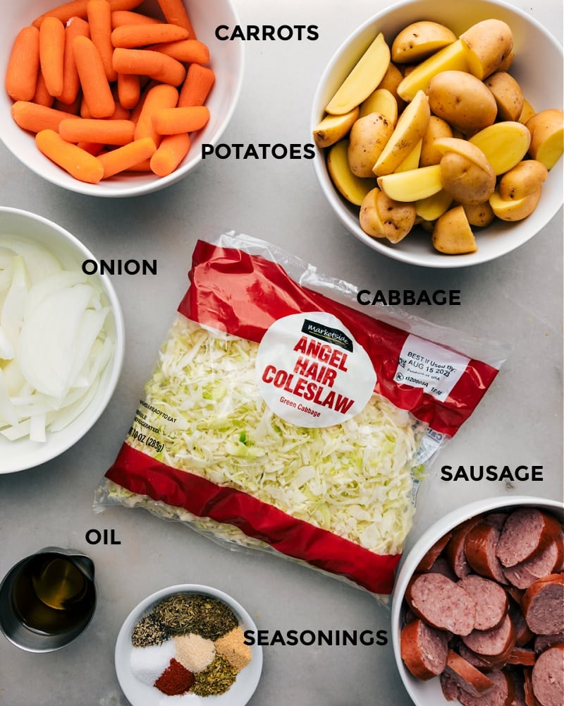 Cabbage, Potatoes, and Sausage combines smoky sausage with roasted veggies, all topped off with a hit of Parmesan and a drizzle of the best creamy dijon sauce! Recipe via chelseasmessyapron #dinner #quick #easy #healthy #onepan #cleaneating #wholefoods #cabbage #potatoes #sausage Ingredient shot-- image of all the ingredients used in this dish