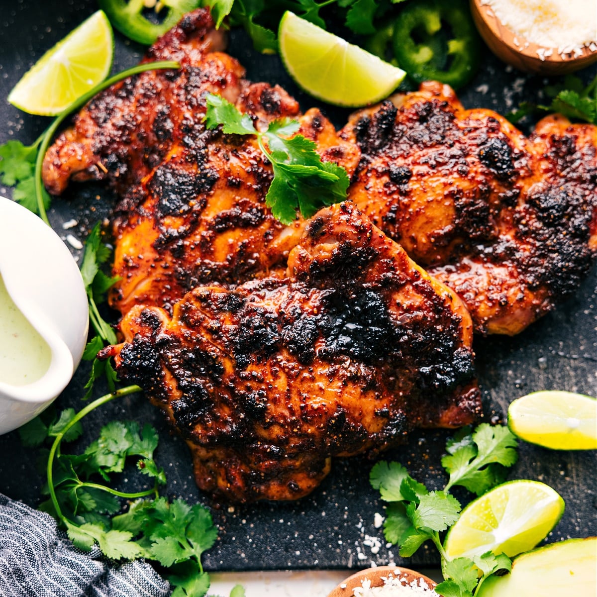One Pan, Broiled Chipotle Chicken Recipe The meat fresh out of the oven with fresh limes, jalapeรฑos, and cilantro to serve with.