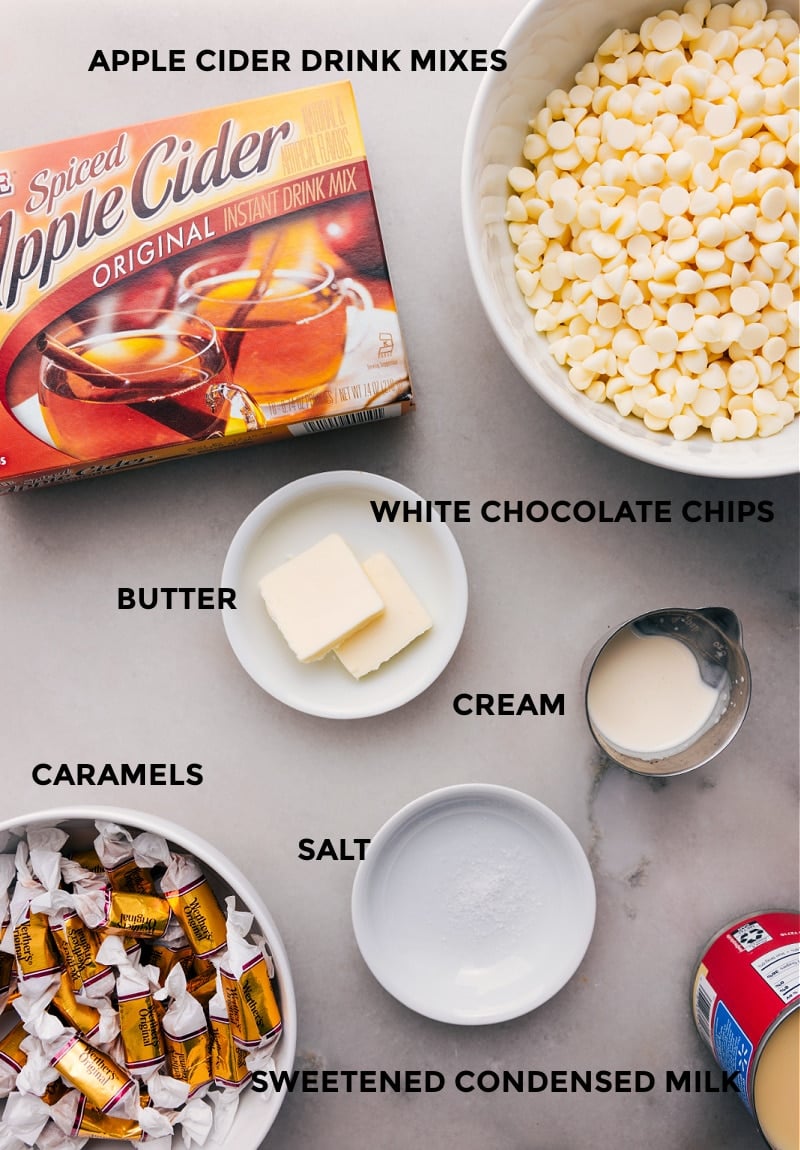 Caramel Apple Fudge combines smooth white chocolate, a hint of apple cider flavor, and creamy caramel. It's an easy recipe, with no candy thermometer required! Recipe via ChelseasMessyApron.com #appleciderfudge #fudge #apples #candy #fall #halloween #creamy Ingredient shot: All the elements required to make Apple Cider Fudge