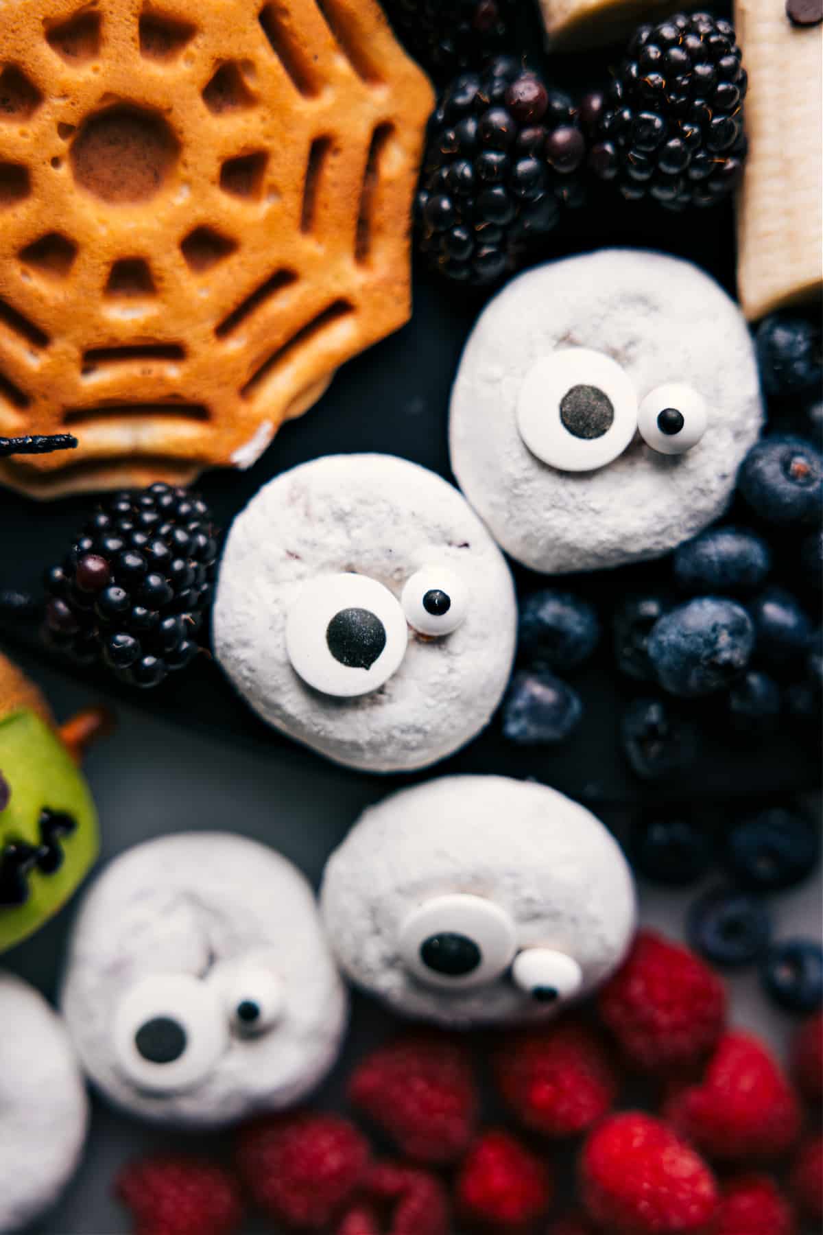 Ghostly Donuts for Halloween morning treat Donuts decorated to resemble ghosts, a Halloween Breakfast Idea.