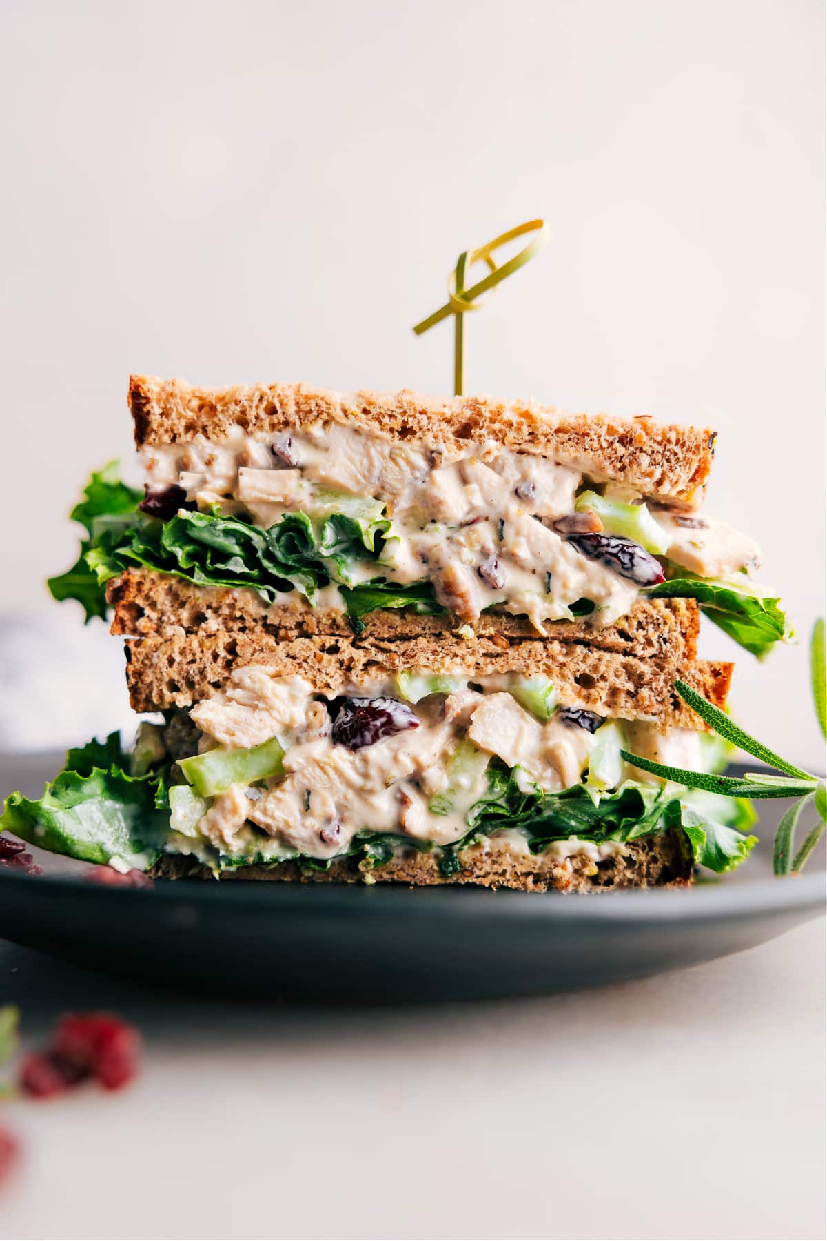 Rosemary Chicken Salad sandwich, halved to reveal its generous, flavorful filling.