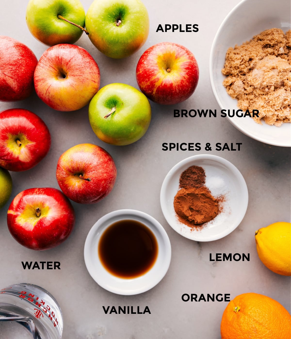 Ingredients In This Hot Apple Cider Recipe The ingredients used in this recipe including the apples, brown sugar, vanilla, and spices.