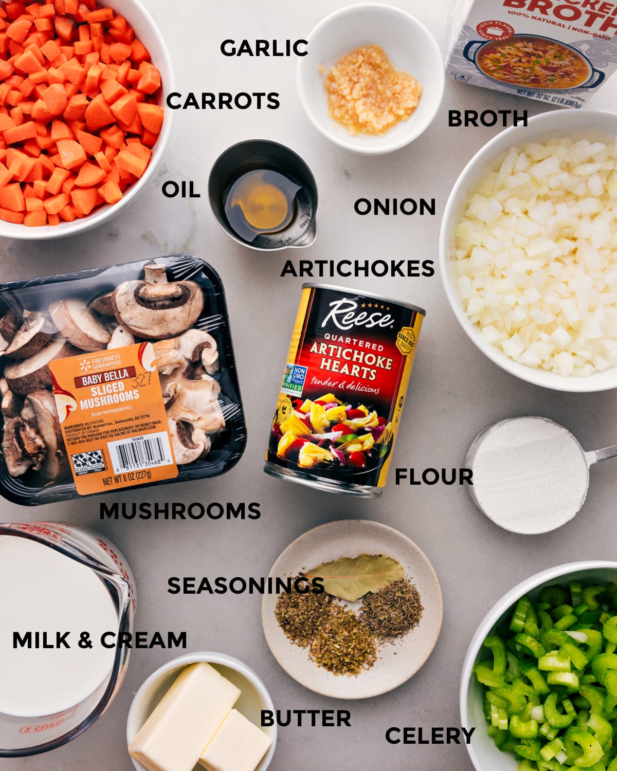 Ingredients for Rich and Creamy Artichoke Soup Recipe with Mushrooms and More Assortment of ingredients for the artichoke soup recipe including mushrooms, butter, onion, milk, cream, and various other items.