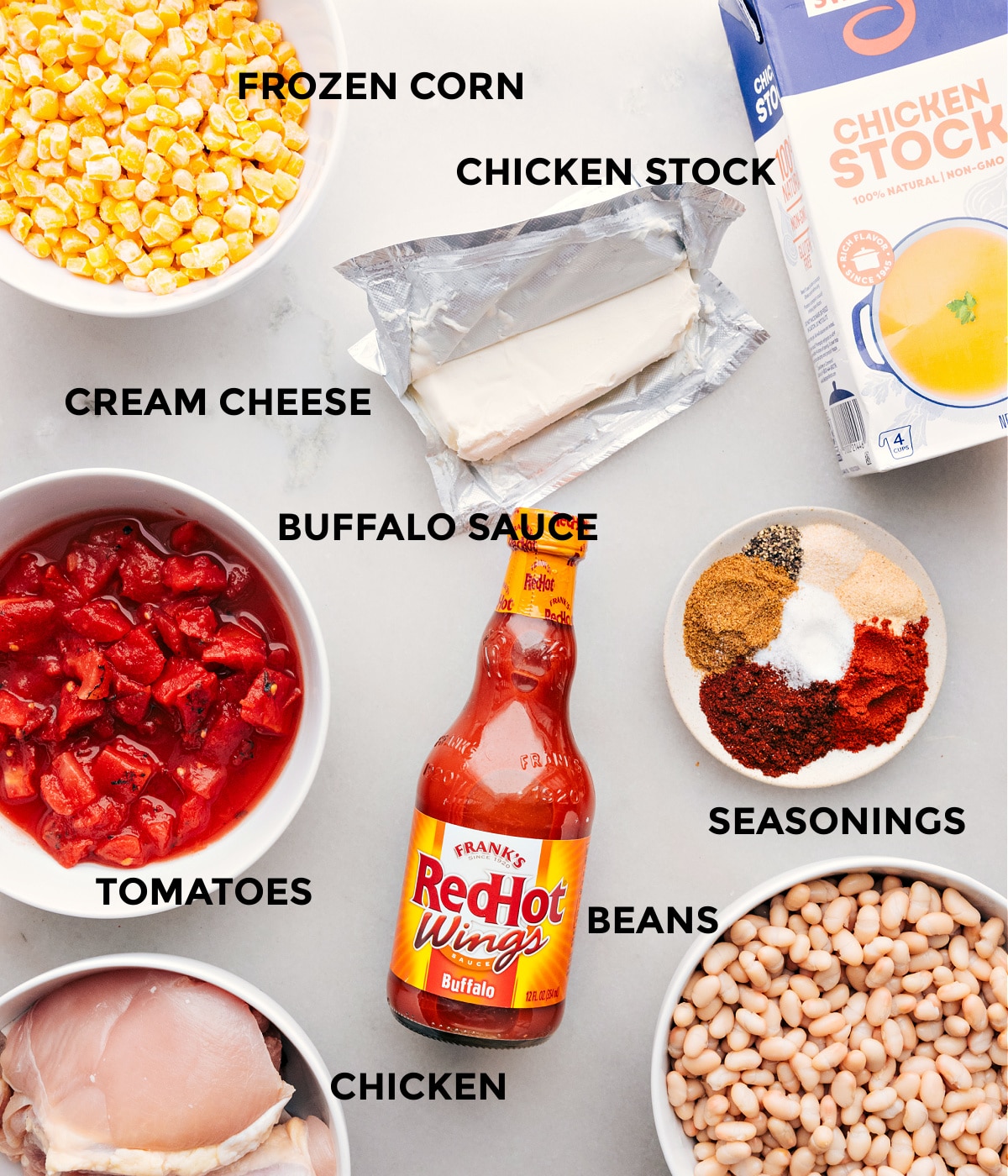 Delicious Ingredients Used In Buffalo Chicken Chili Ingredients used in this dish, including hot sauce, corn, beans, tomatoes, chicken stock, and chicken.