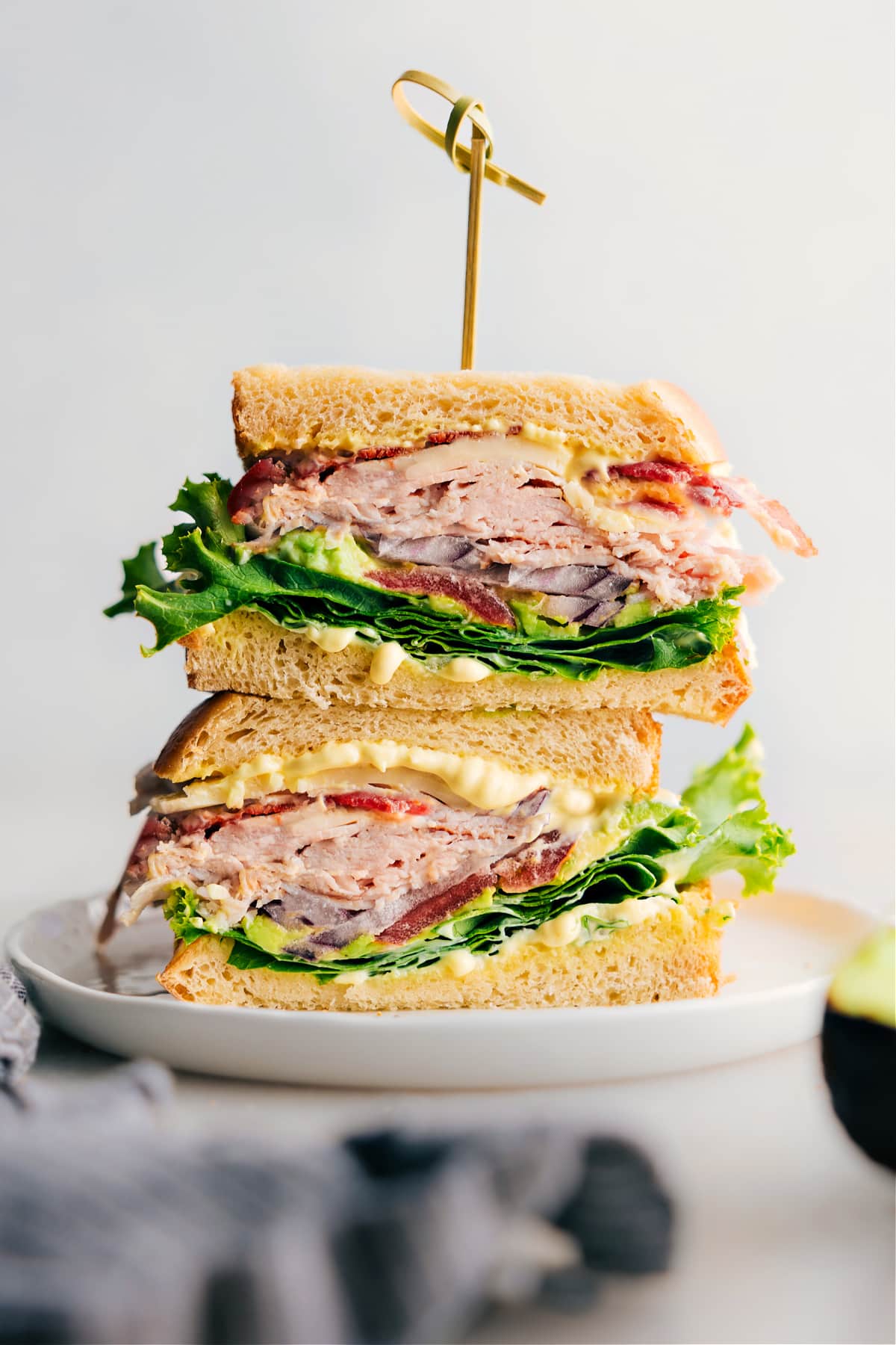 Delicious Turkey Sandwich with Thanksgiving Leftovers, Fresh Vegetables, and Flavorful Sauce A thick and flavor-packed Turkey Bacon Avocado Sandwich made with delicious Thanksgiving leftovers, fresh vegetables, and a savory sauce.