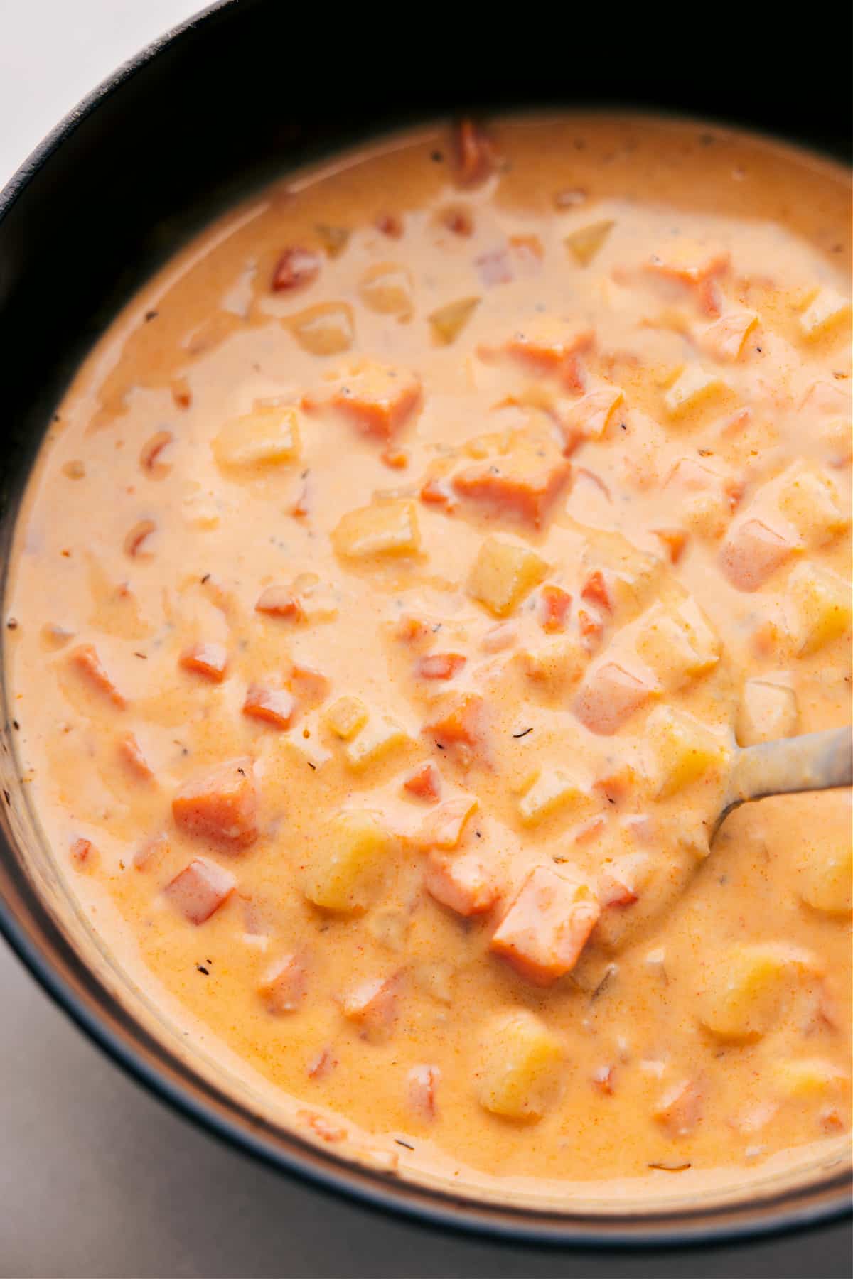 Cheesy Potato Soup--it's comfort in a bowl. Overhead photo of Cheesy Potato Soup