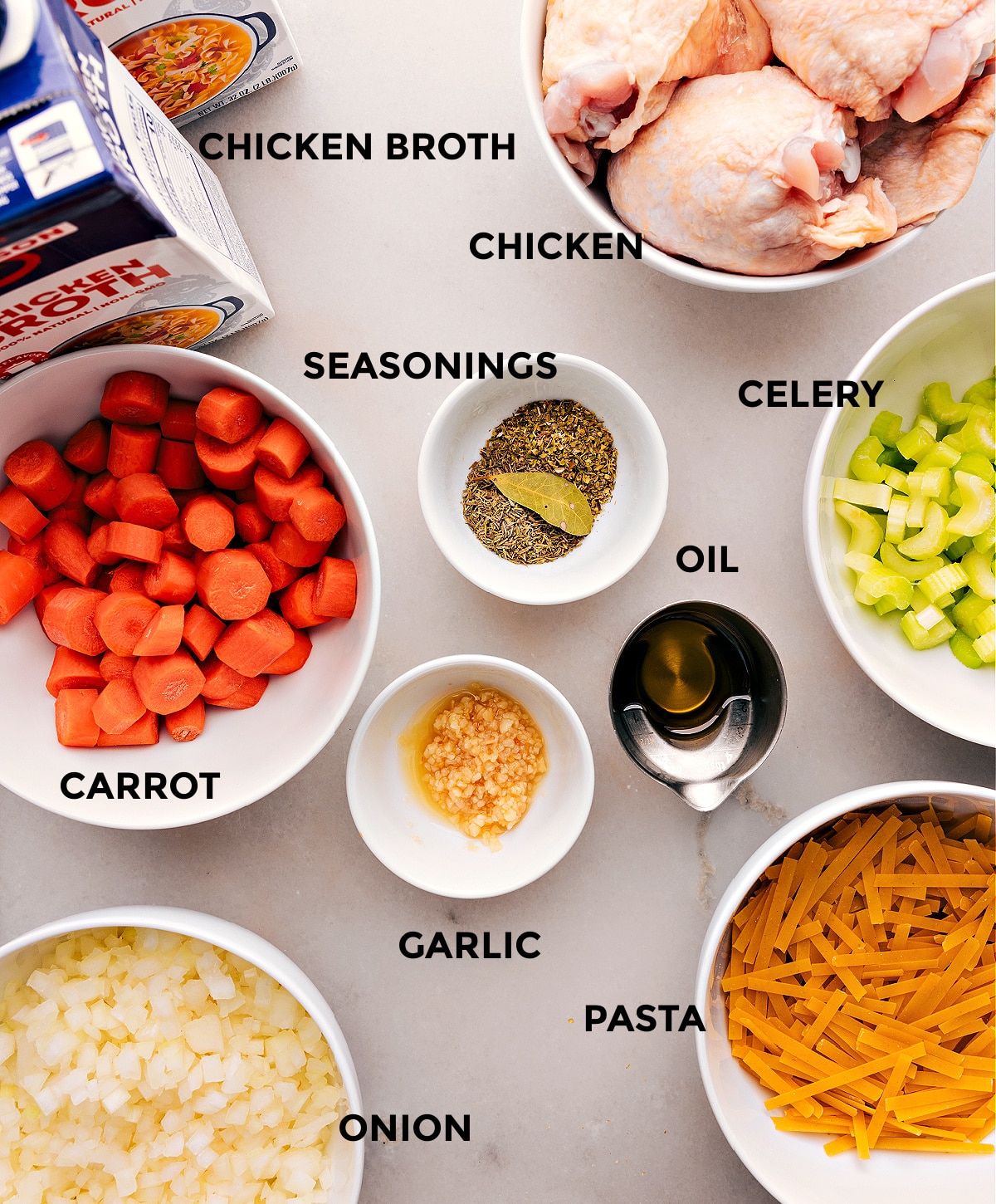 Ingredients In Chicken Noodle Soup All the ingredients used in this dish spread out on a board.