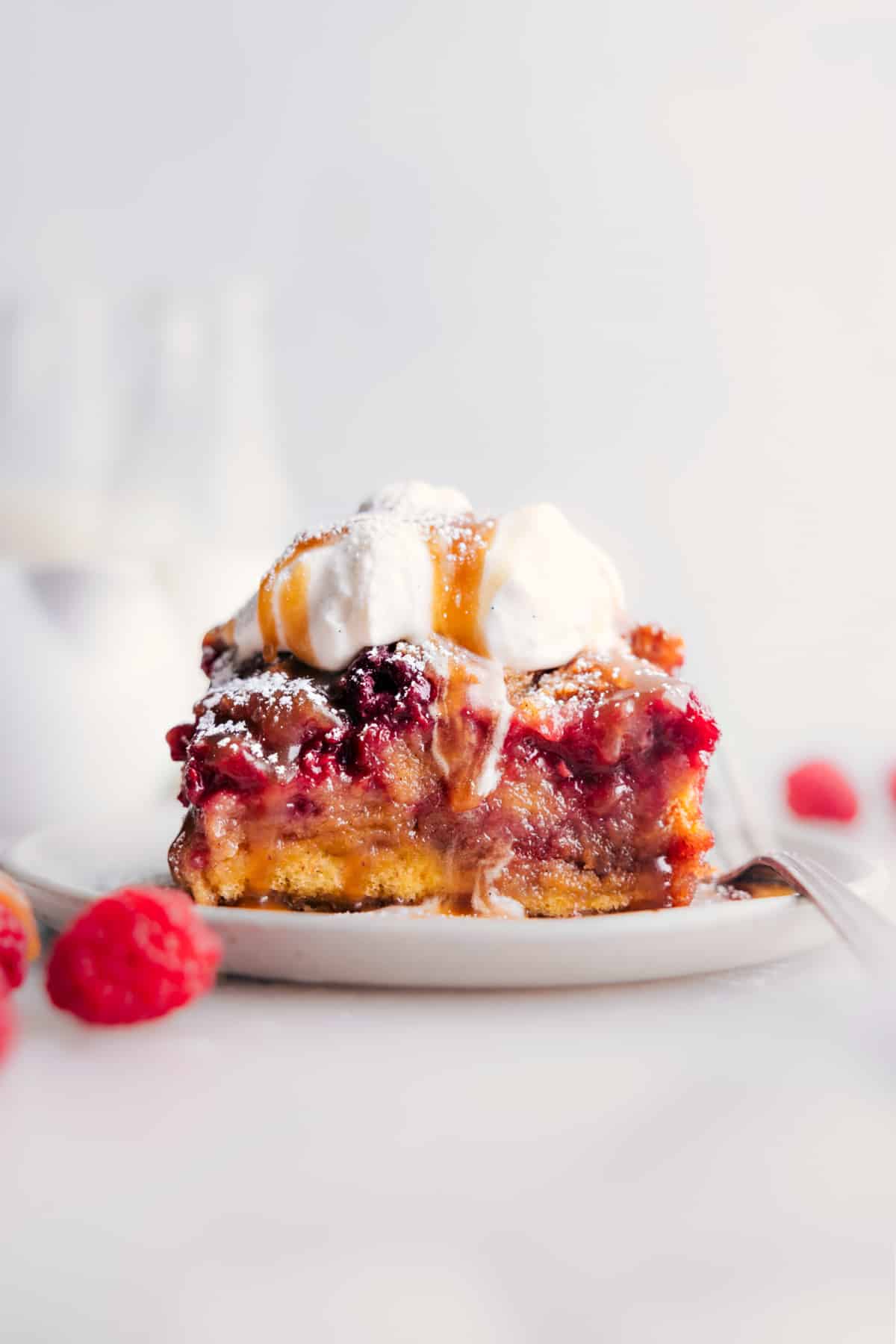 The Best Raspberry Bread Pudding Slice of Raspberry Bread Pudding on a plate ready to be enjoyed.