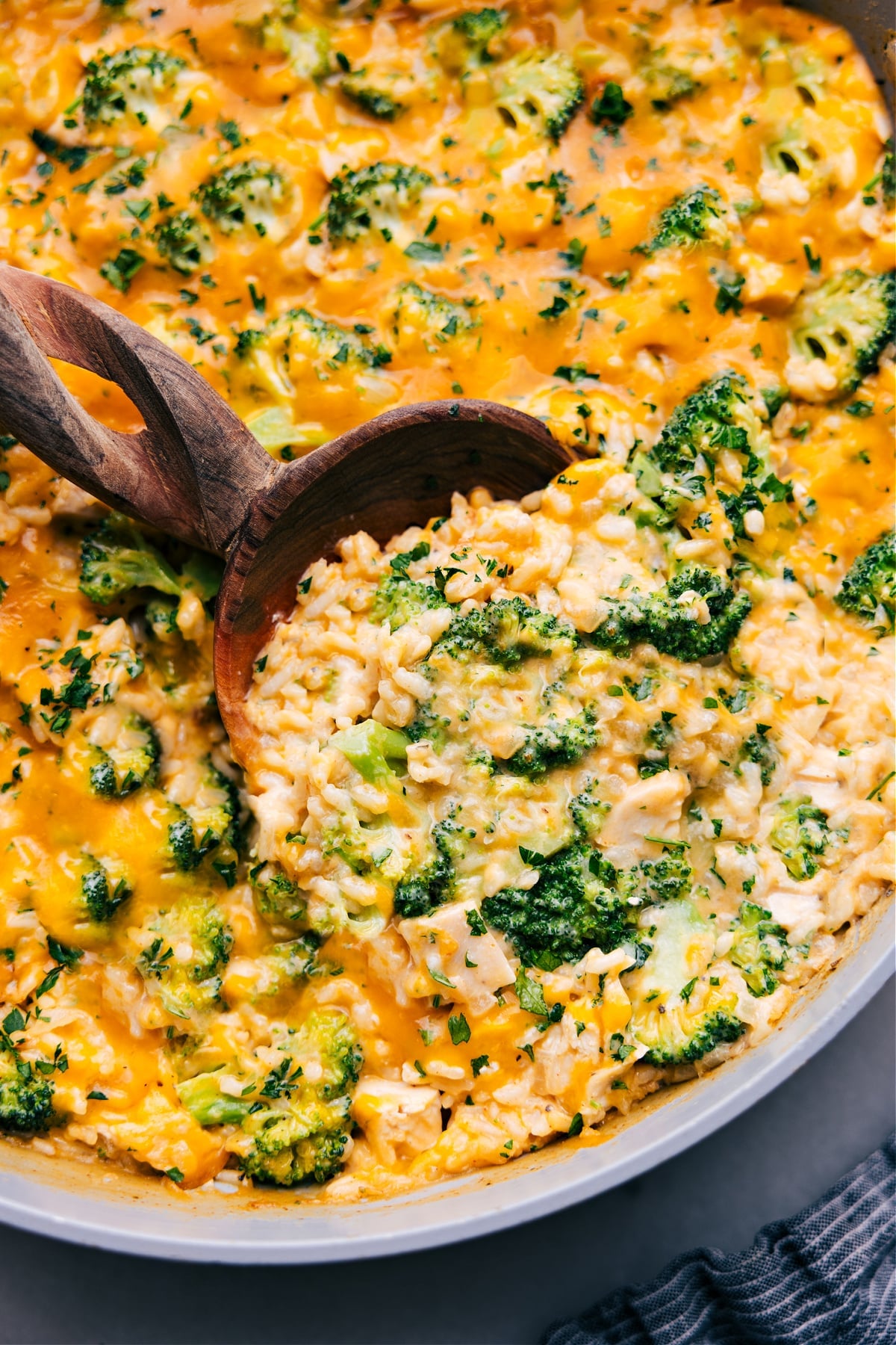 Creamy And Delicious Chicken Broccoli Rice Casserole A big spoonful of the dish being scooped out to serve.