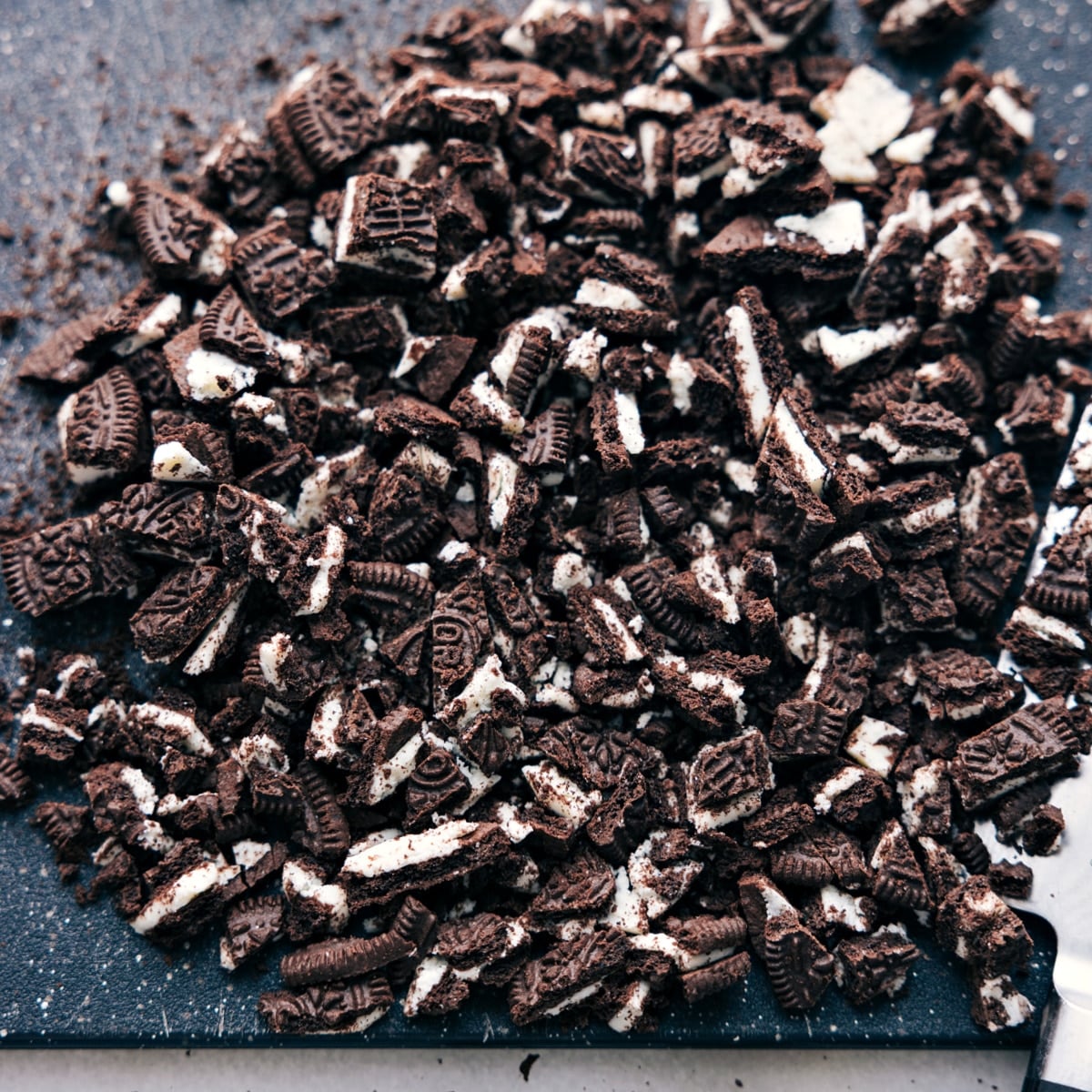 Easy Oreo Fluff Oreos chopped out to be added to the oreo fluff.