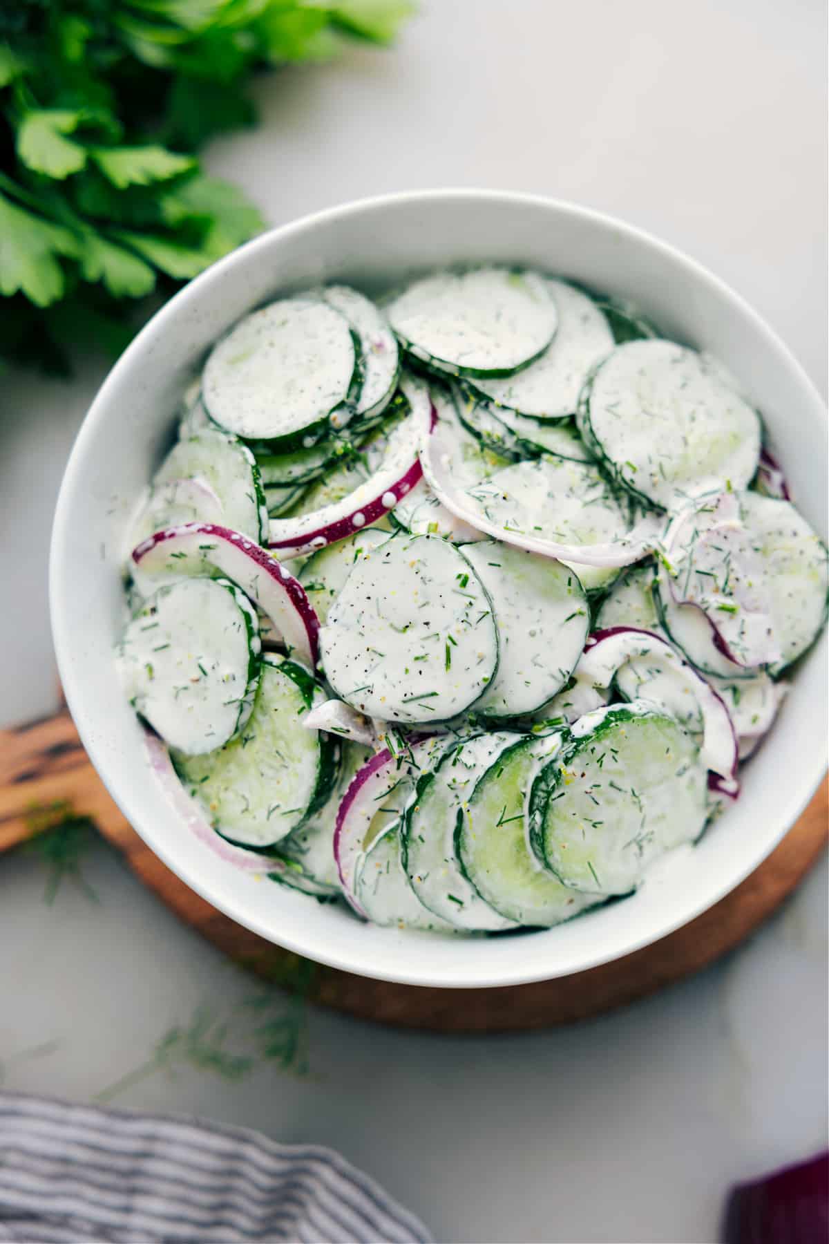 Creamy Cucumber Salad Recipe Everyone Loves Creamy Cucumber Salad assembled and ready to be enjoyed.