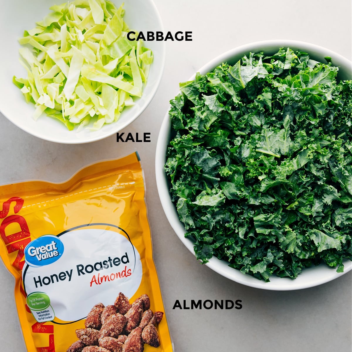 Ingredients In Chick-Fil-A Kale Salad All the three ingredients including cabbage, kale, and almonds prepped out for easy assembly.