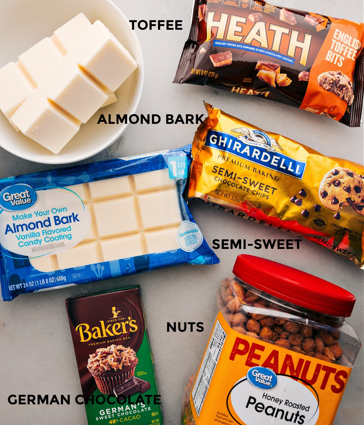 Ingredients In Crockpot Candy Ingredients ready for easy assembly: almond bark, chocolate chips, German chocolate, nuts, and Heath toffee bits.