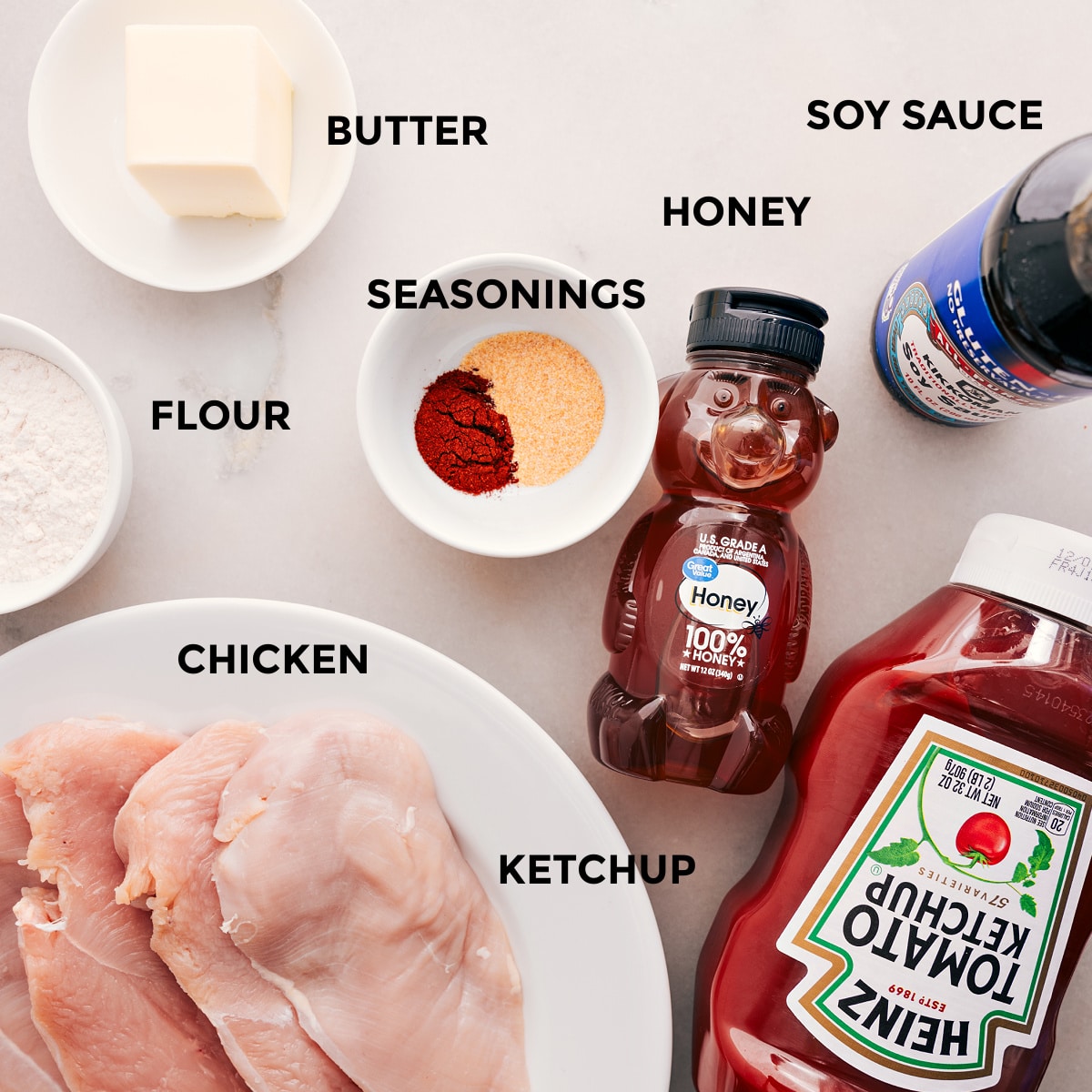 Ingredients In Honey Garlic Chicken Recipe All the ingredients for this recipe are prepped and ready for easy assembly: butter, soy sauce, honey, seasonings, ketchup, meat, and flour.