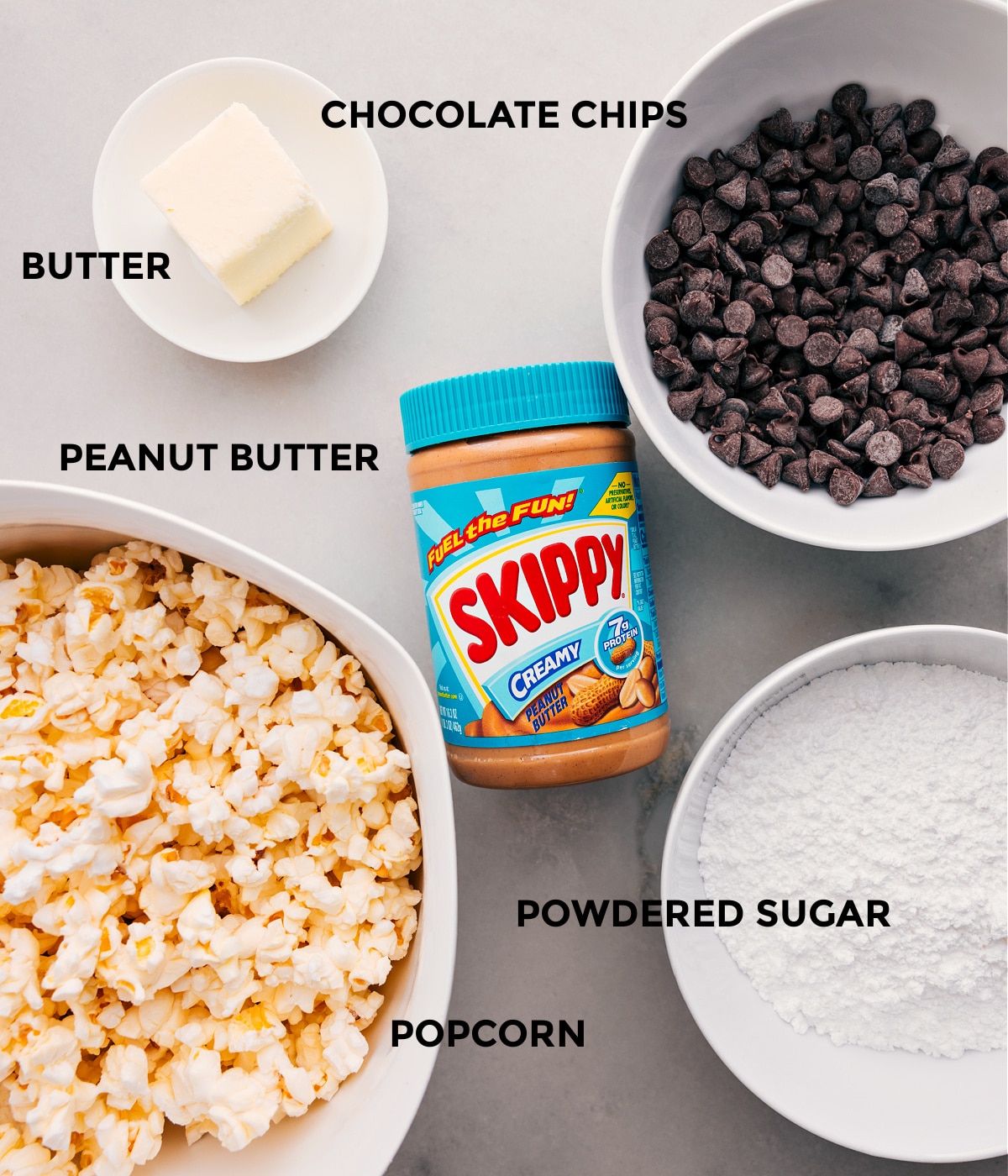 Ingredients In Popcorn Puppy Chow Recipe This recipe includes chocolate chips, popcorn, peanut butter, powdered sugar, and butter.