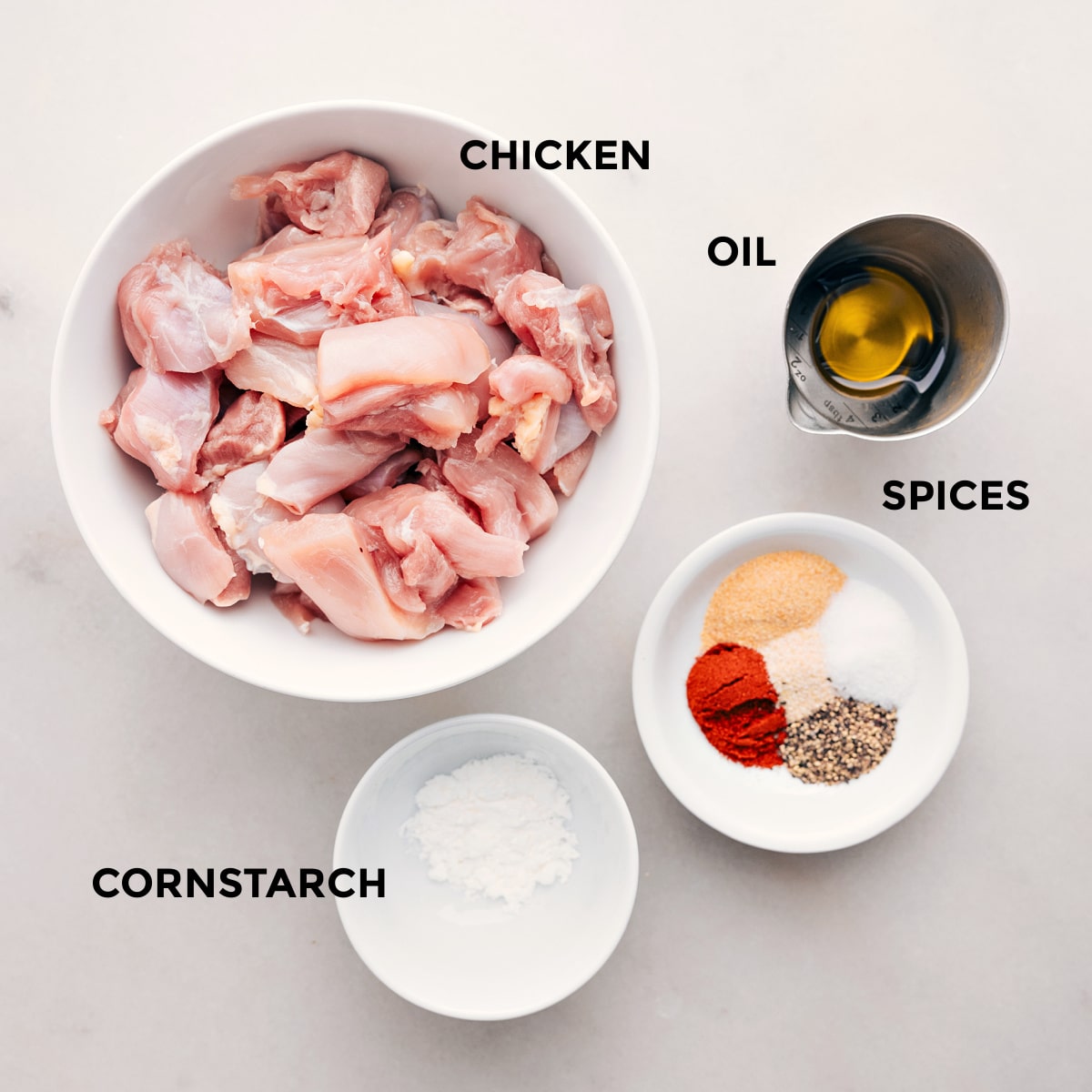 Ingredients In Bang Bang Chicken Skewers The meat is prepped with spices, oil, and cornstarch to make the recipe.