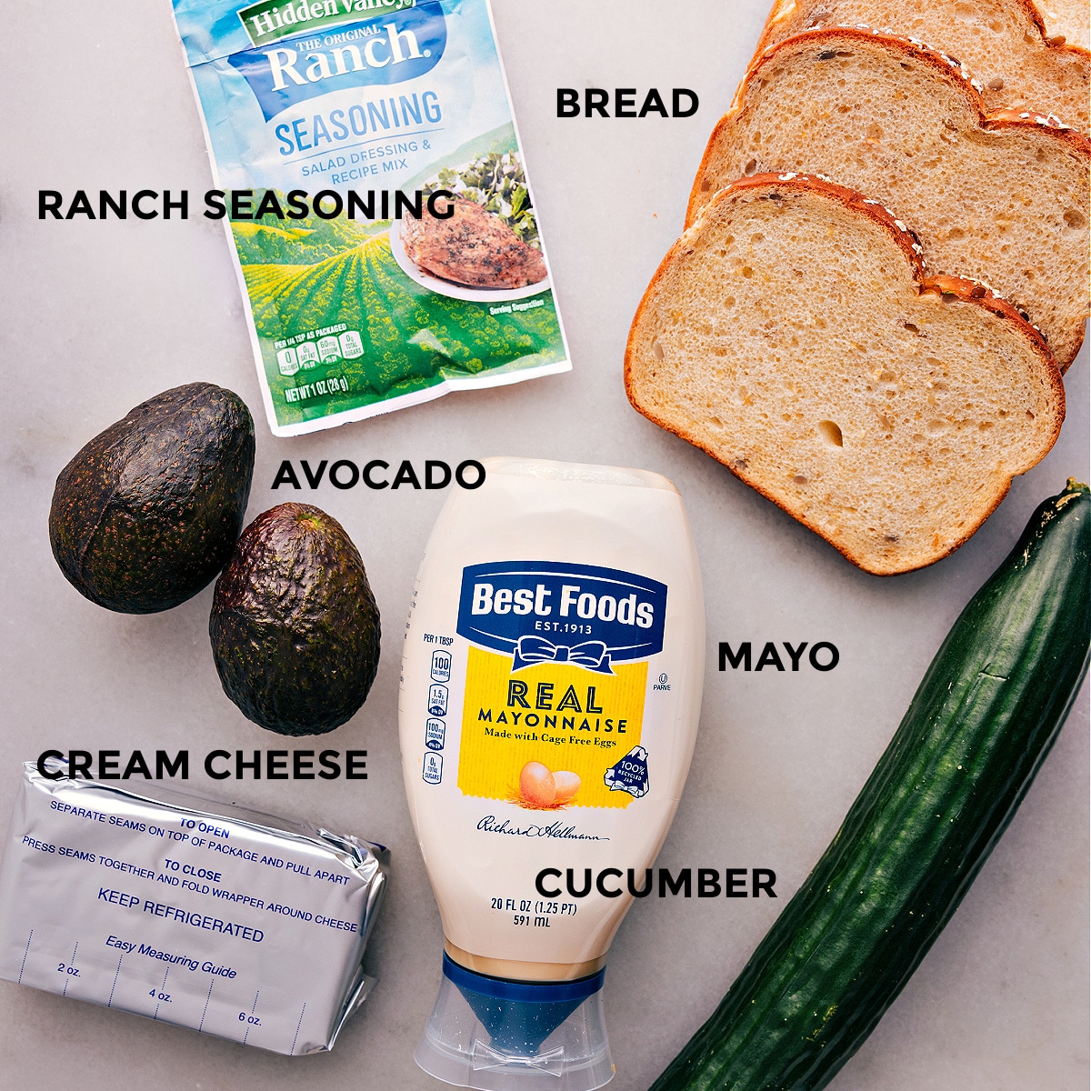 Ingredients In Avocado Sandwich Recipe All the ingredients in this recipe are prepped for easy assembly, including bread, ranch seasoning, veggies, mayo, and cream cheese.