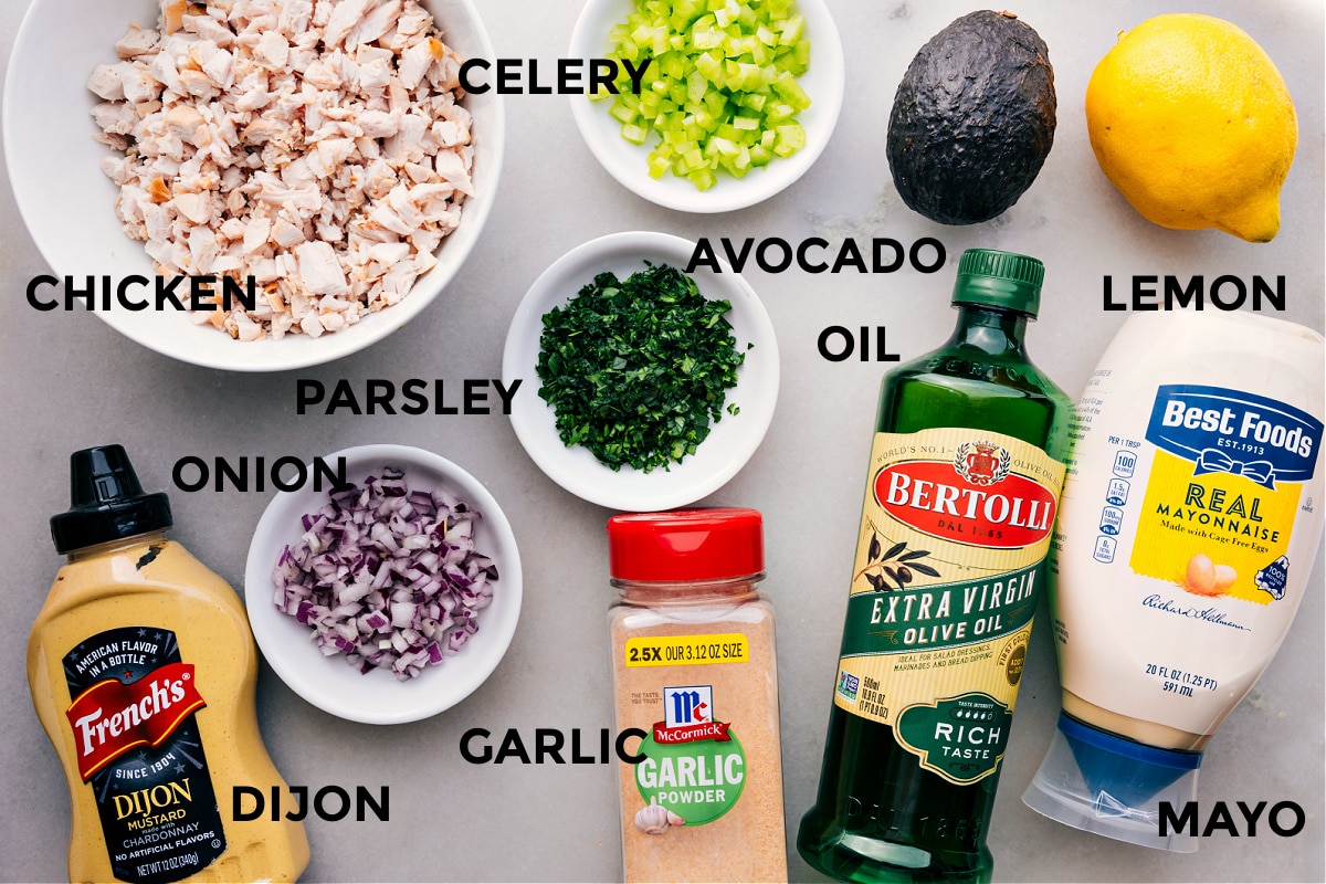 Ingredients In Chicken Avocado Sandwich All the ingredients in this recipe prepped out for easy assembly including the meat, celery, avocado, parsley, onion, oil, lemon, mayo, garlic, and dijon.