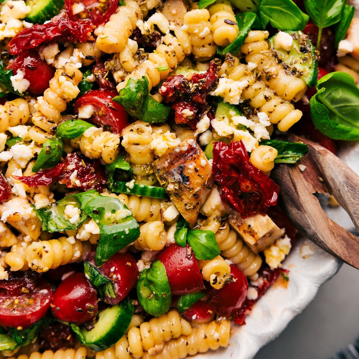 The Perfect Weeknight Dinner Or Side: Marry Me Chicken Pasta Salad Marry me chicken pasta salad recipe in a bowl tossed with the dressing.