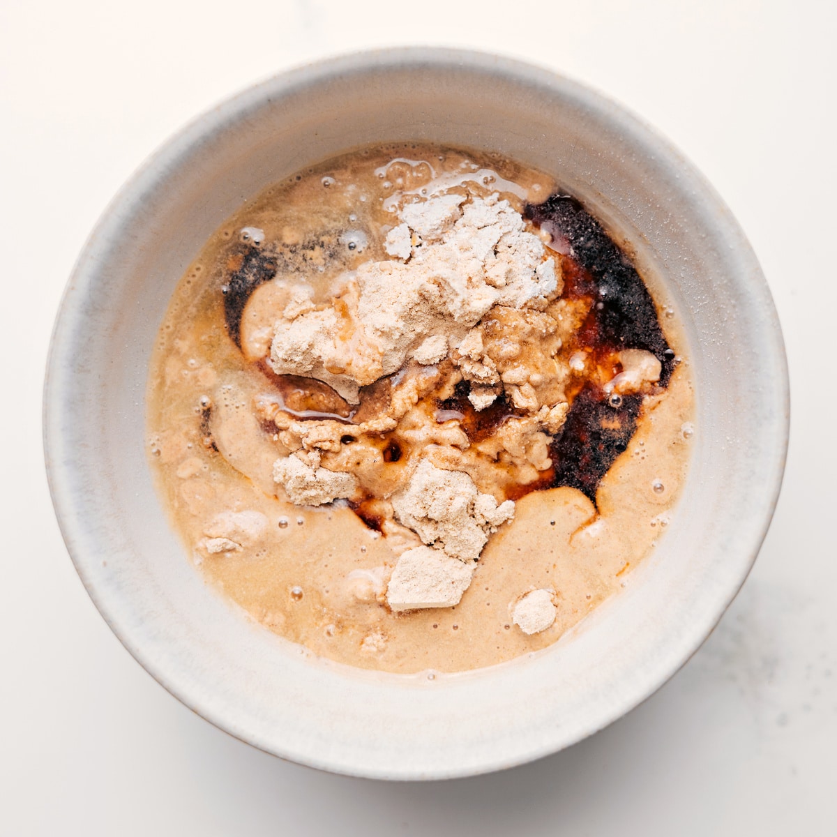 How To Make Protein Cookie Dough All the ingredients for protein cookie dough combined in a bowl to create the most delicious high-protein treat.