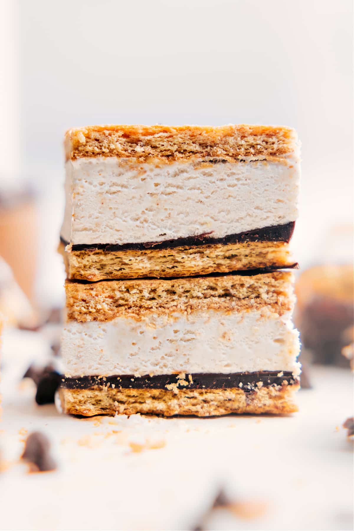 Frozen Protein S’mores stacked in a neat pile, showing the creamy center and chocolate layers, ready to be enjoyed.