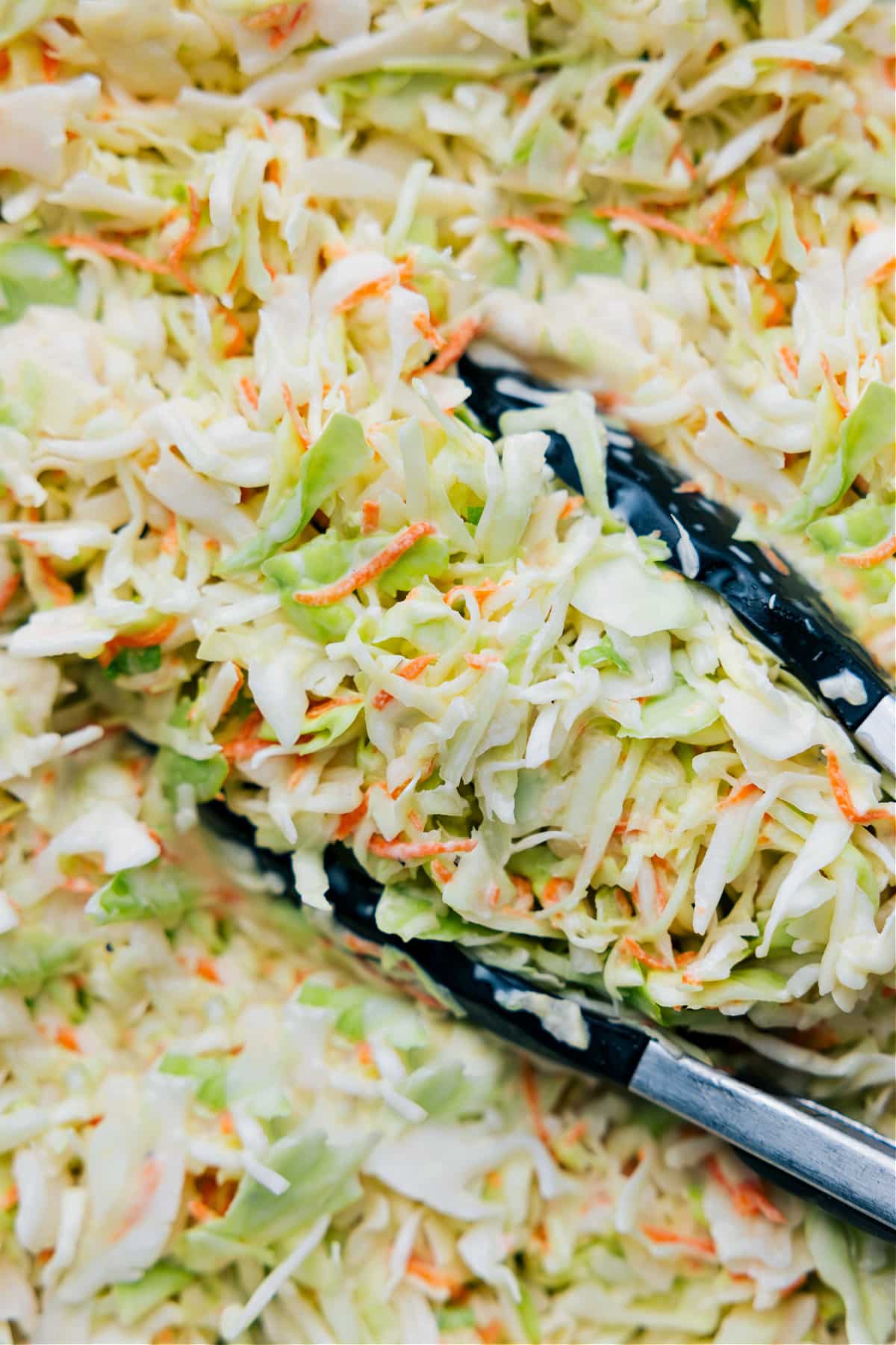 How To Make Chick-Fil-A Coleslaw Cabbage The cabbage, coleslaw, and carrots added to the dressing and it all mixed together.