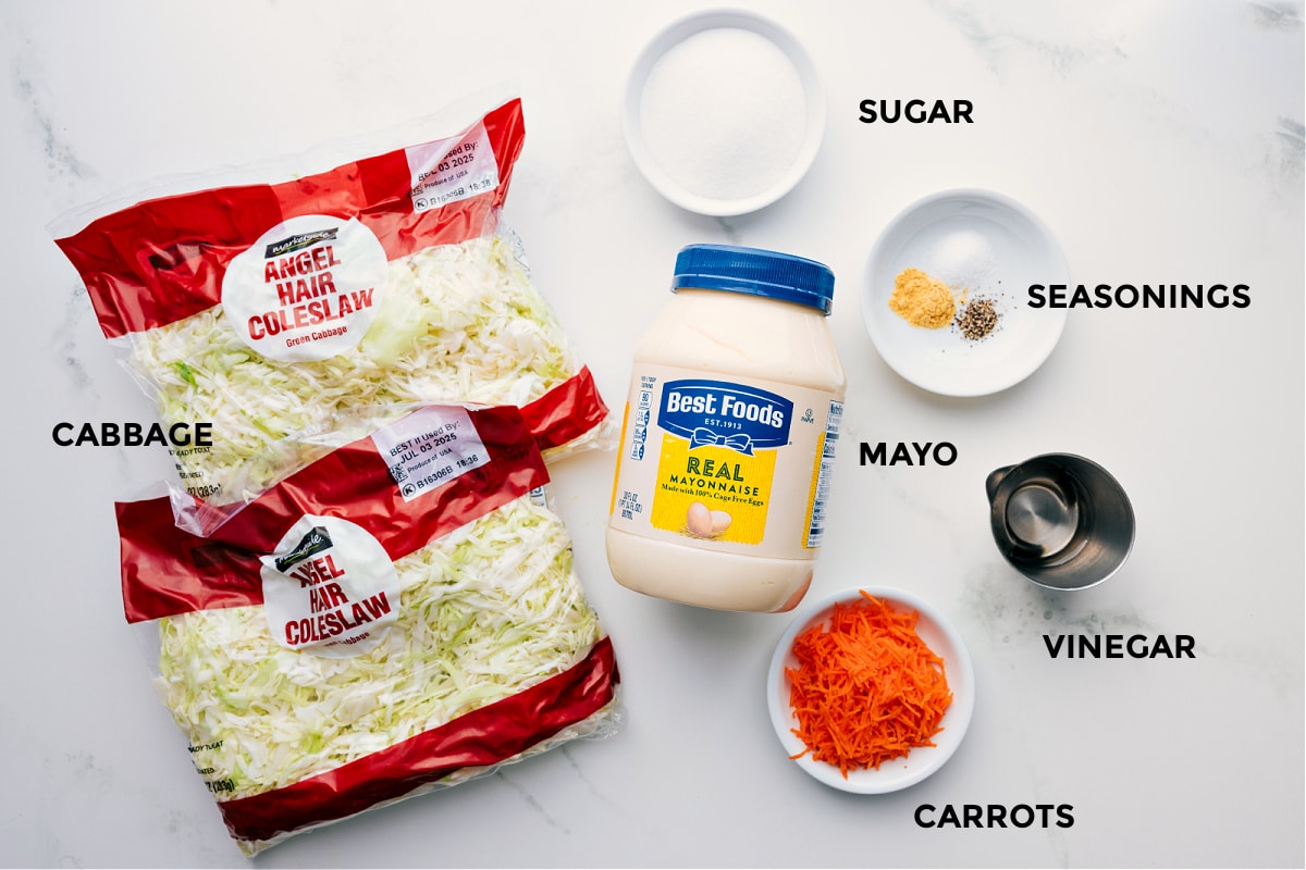 Ingredients In Chick-Fil-A Coleslaw Recipe All ingredients prepped, including angel hair coleslaw, cabbage, mayo, sugar, seasonings, carrots, and vinegar.