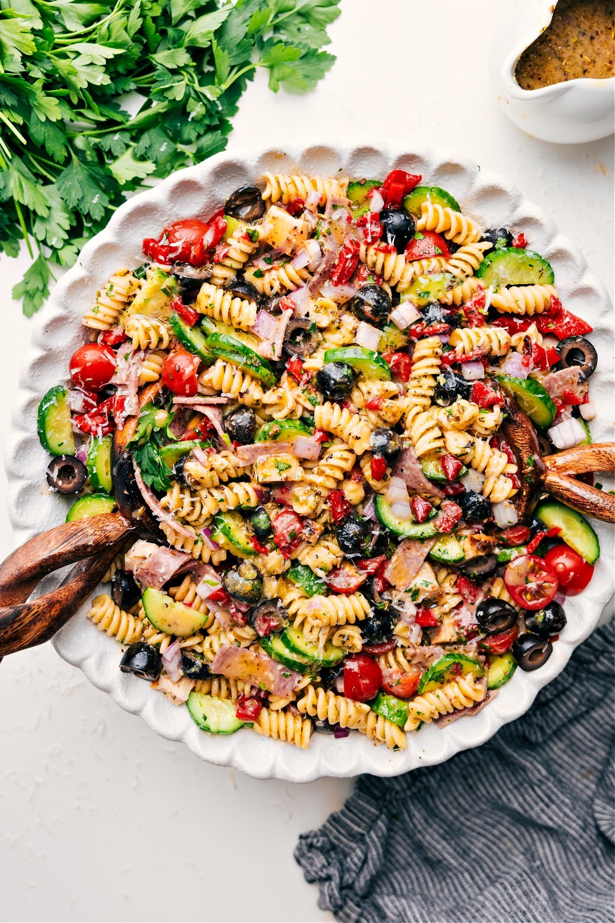 Italian Pasta Salad Recipe served in a bowl with fresh veggies and dressing.