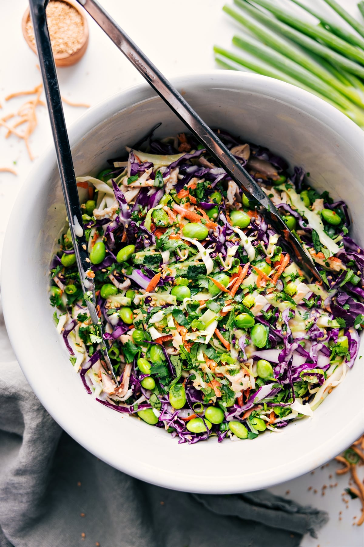 Fresh And Flavorful Asian Slaw Recipe Asian Slaw Recipe in a bowl tossed together with dressing.