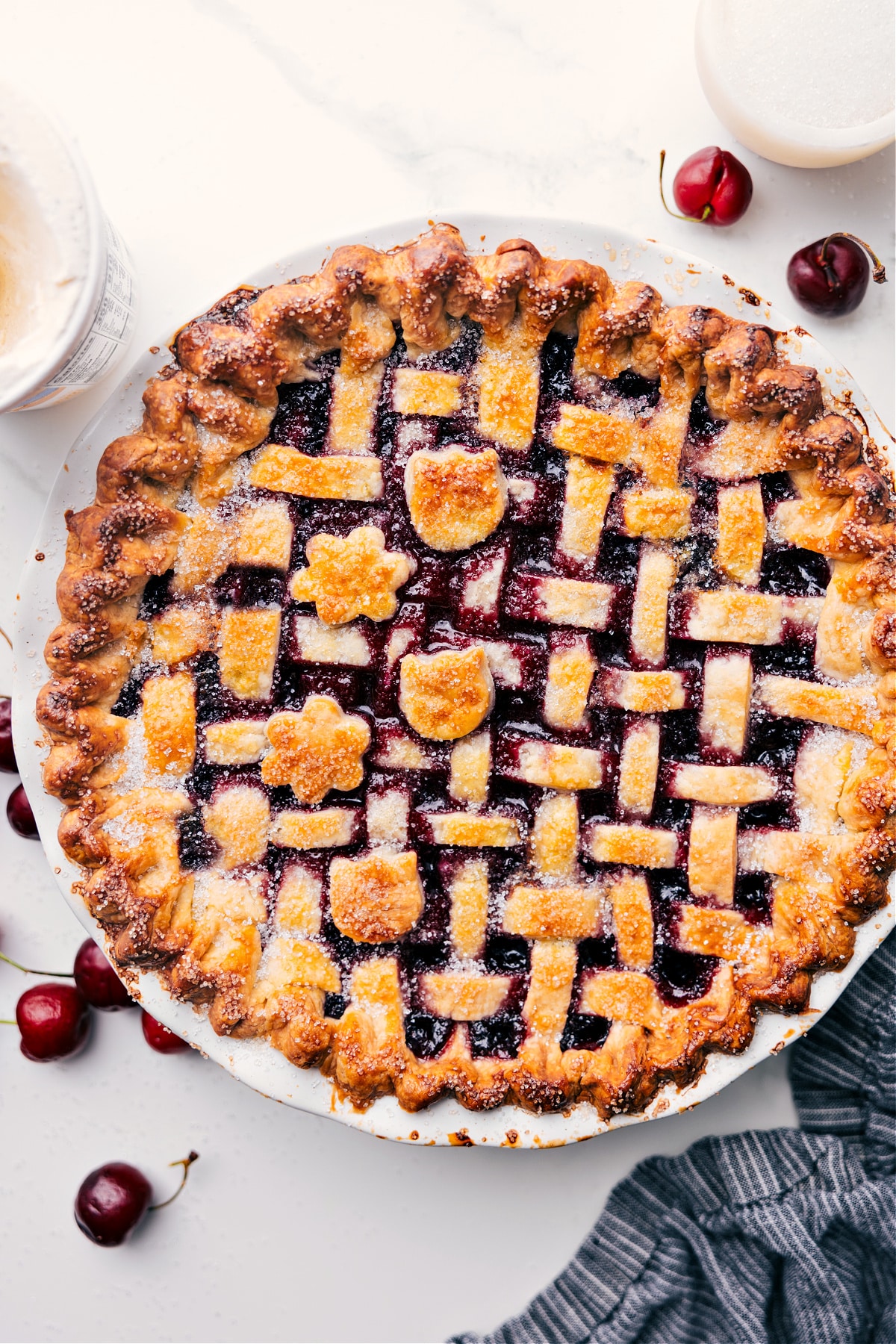The Best Cherry Pie Recipe Golden-brown cherry pie recipe just out of the oven, waiting to be cut.
