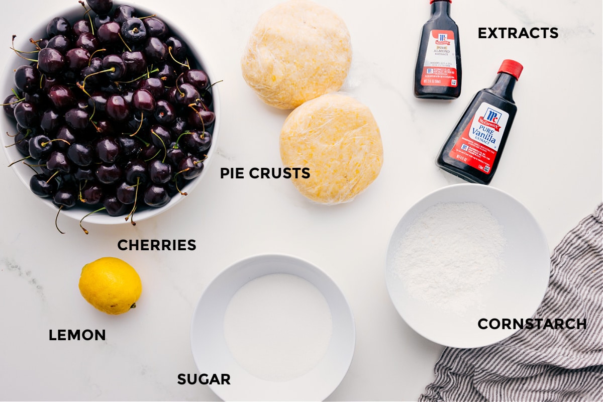 Ingredients In Cherry Pie Recipe Prepped ingredients for this recipe including cherries, pie crusts, lemon, sugar, cornstarch, and extracts.