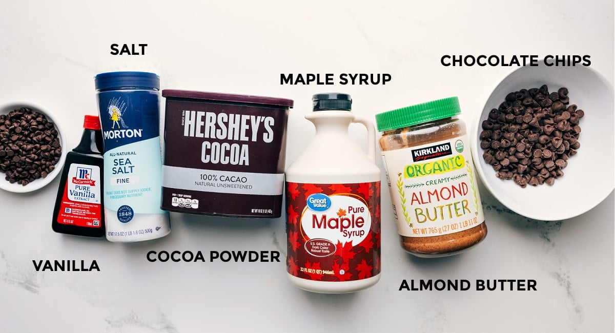 Ingredients In Healthy Brownie Batter Ingredients in this recipe prepped out for easy assembly including the chocolate chips, vanilla, cocoa powder, maple syrup, and almond butter.