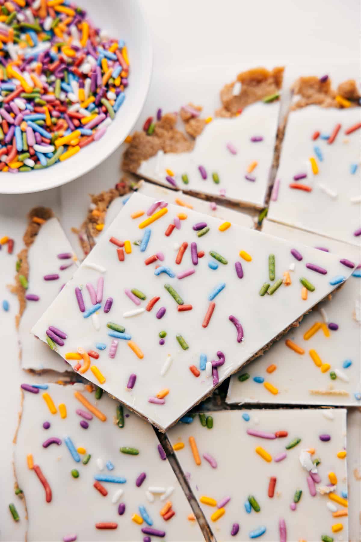 Healthy Cake Batter Bark with white chocolate on top and sprinkles.