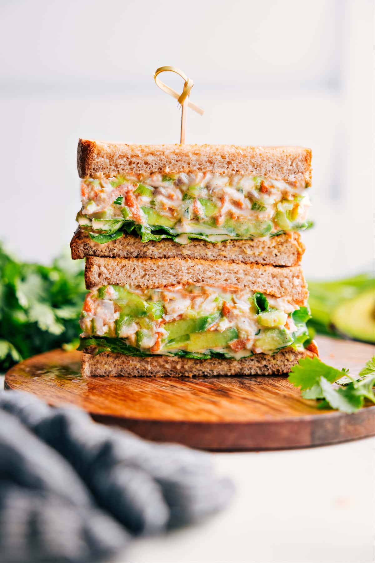 Hot Honey Chicken Salad sandwiches stacked on top of each other.