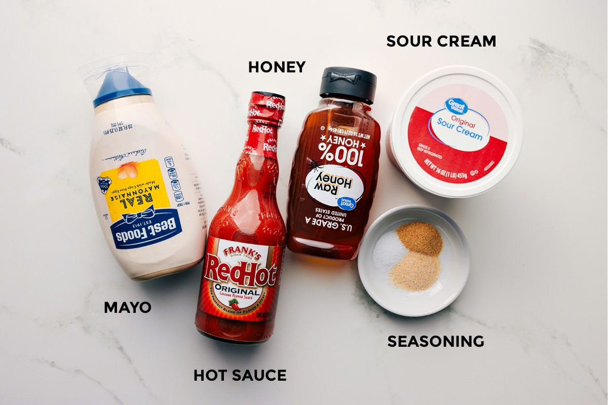 How To Make The Best Hot Honey Chicken Salad Dressing The hot honey chicken salad dressing prepped including the mayo, hot sauce, honey, sour cream, and seasoning.