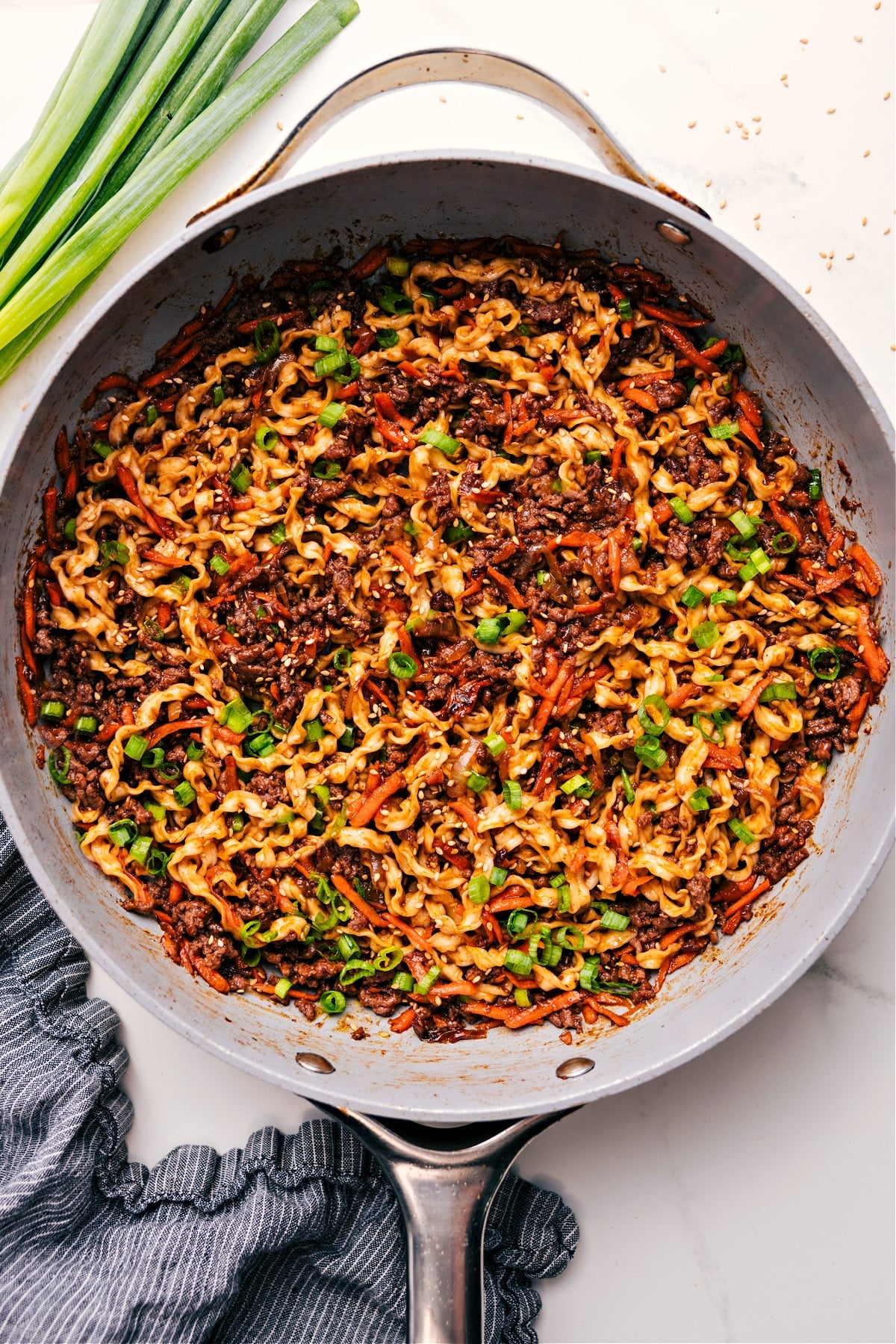 Family Favorite Beef Noodle Bowls Recipe Beef Noodle Bowls simmering in a pot with noodles, beef, and veggies, ready to be served.