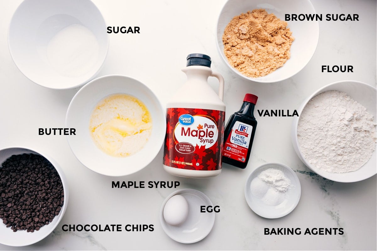 Ingredients In Tiny Chocolate Chip Cookies All the ingredients in this recipe prepped out for easy assembly including the sugar, butter, maple syrup, chocolate chips, egg, brown sugar, flour, vanilla, and baking agents.