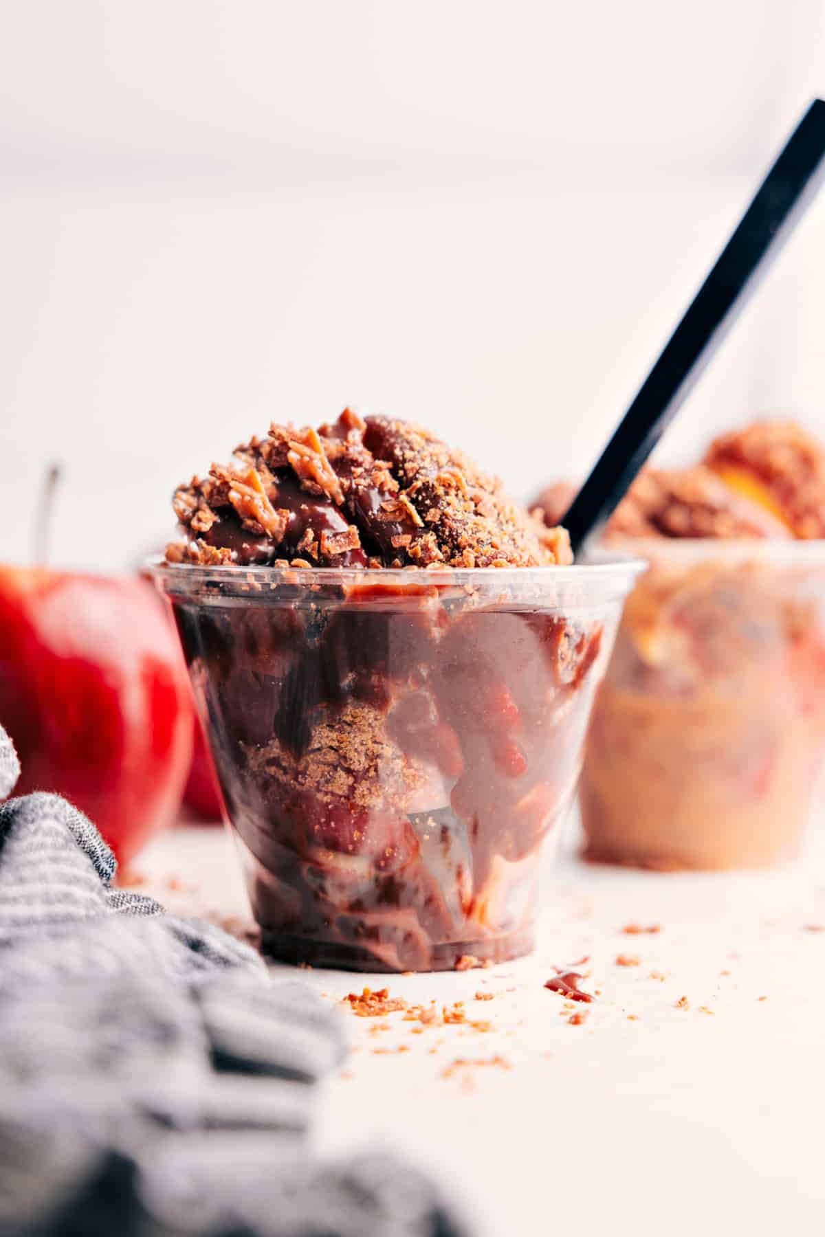 The Ultimate Fall Dessert: Caramel Apple Dessert Cups Caramel Apple Dessert Cups topped with extra chocolate and toasted coconut, ready to serve.