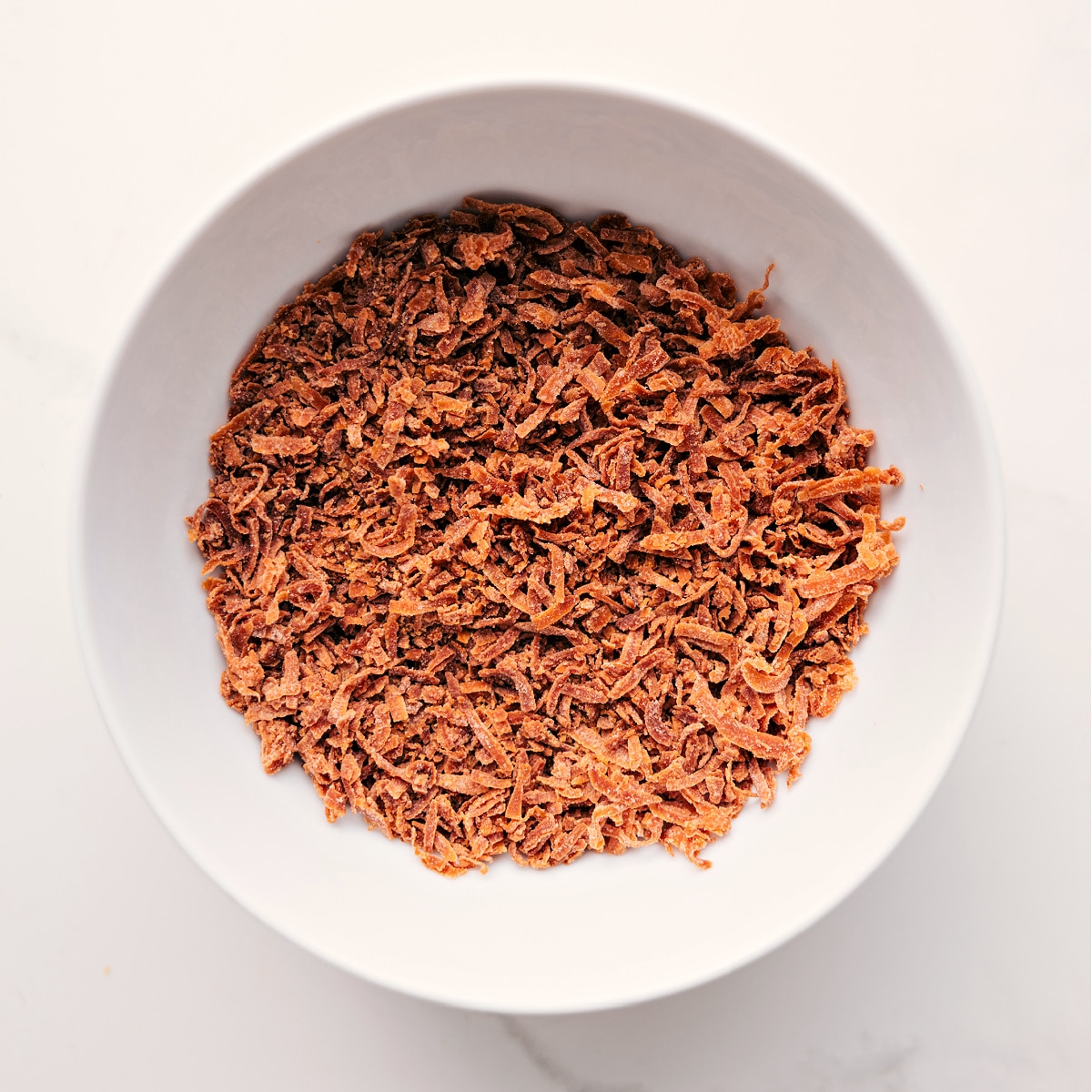 Toasted Coconut To Top Caramel Apple Dessert Cups Toasted coconut prepared to sprinkle on top of this dessert.