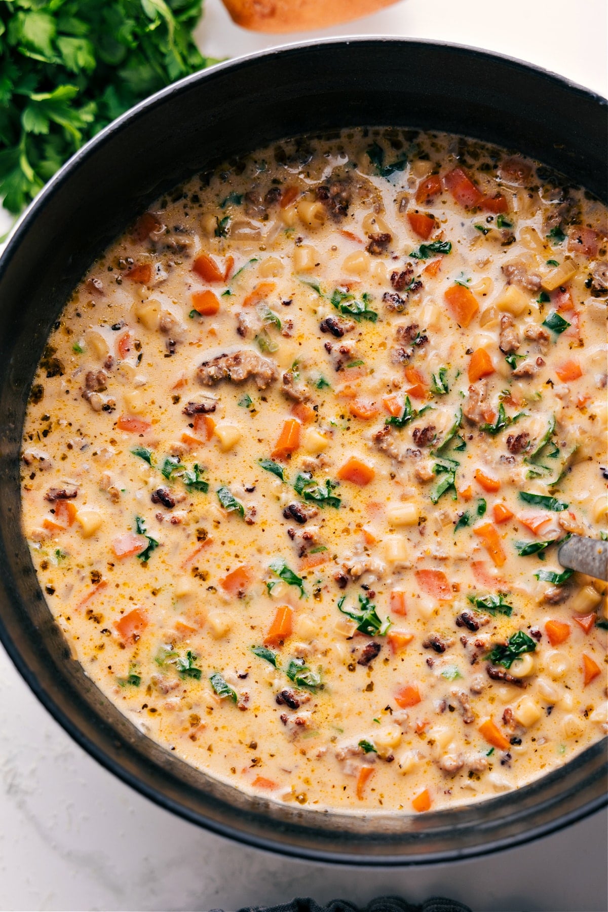 Creamy Parmesan Italian Sausage Soup in the pot ready to be enjoyed.