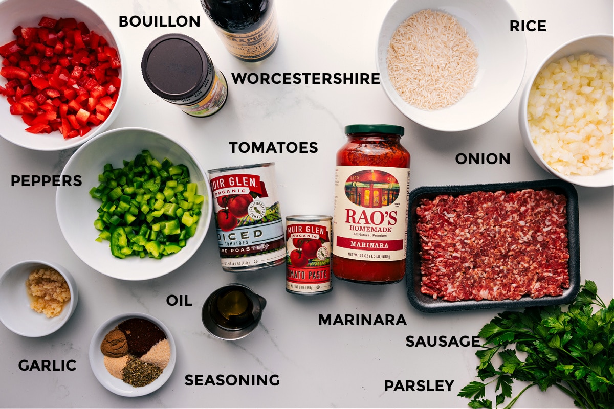 Ingredients In Crockpot Stuffed Pepper Soup All the ingredients in this recipe prepped for easy assembly including peppers, garlic, seasoning, oil, tomatoes, bouillon, Worcestershire, sausage, parsley, onion, rice.