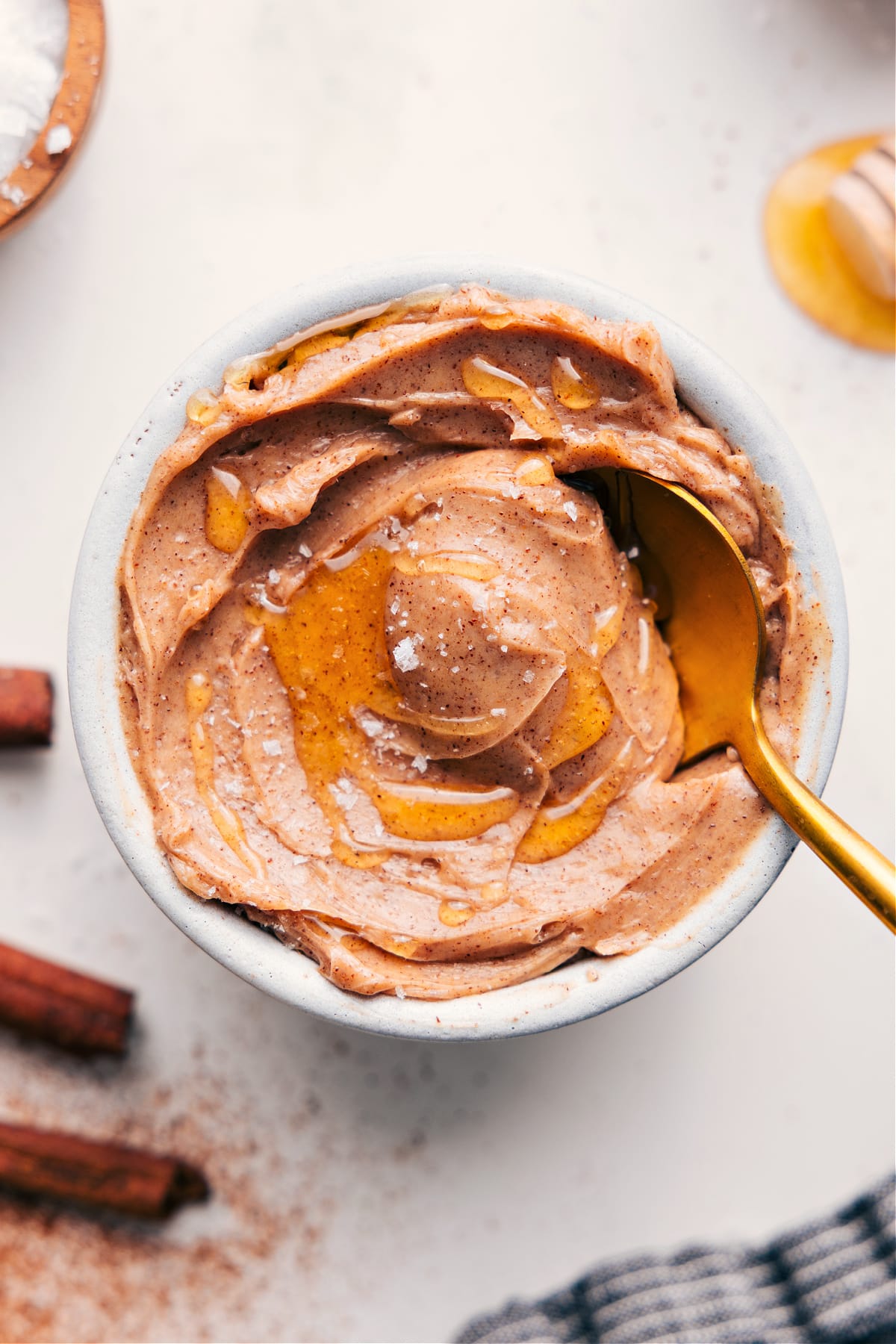 Creamy Honey Buter Recipe In A Bowl Honey Butter Recipe in a bowl with an extra honey swirl and flaky sea salt.