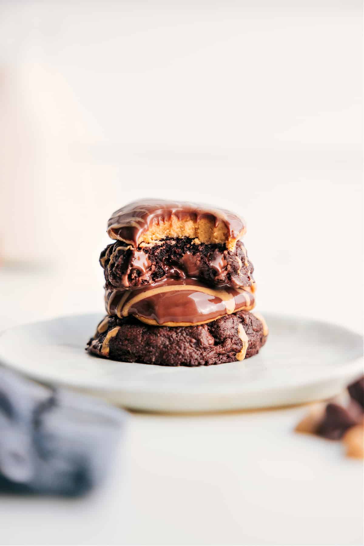 The Best New Cookie Recipe: Buckeye Brownie Cookies Buckeye Brownie Cookies stacked on top of each other with a bite out of the top one.