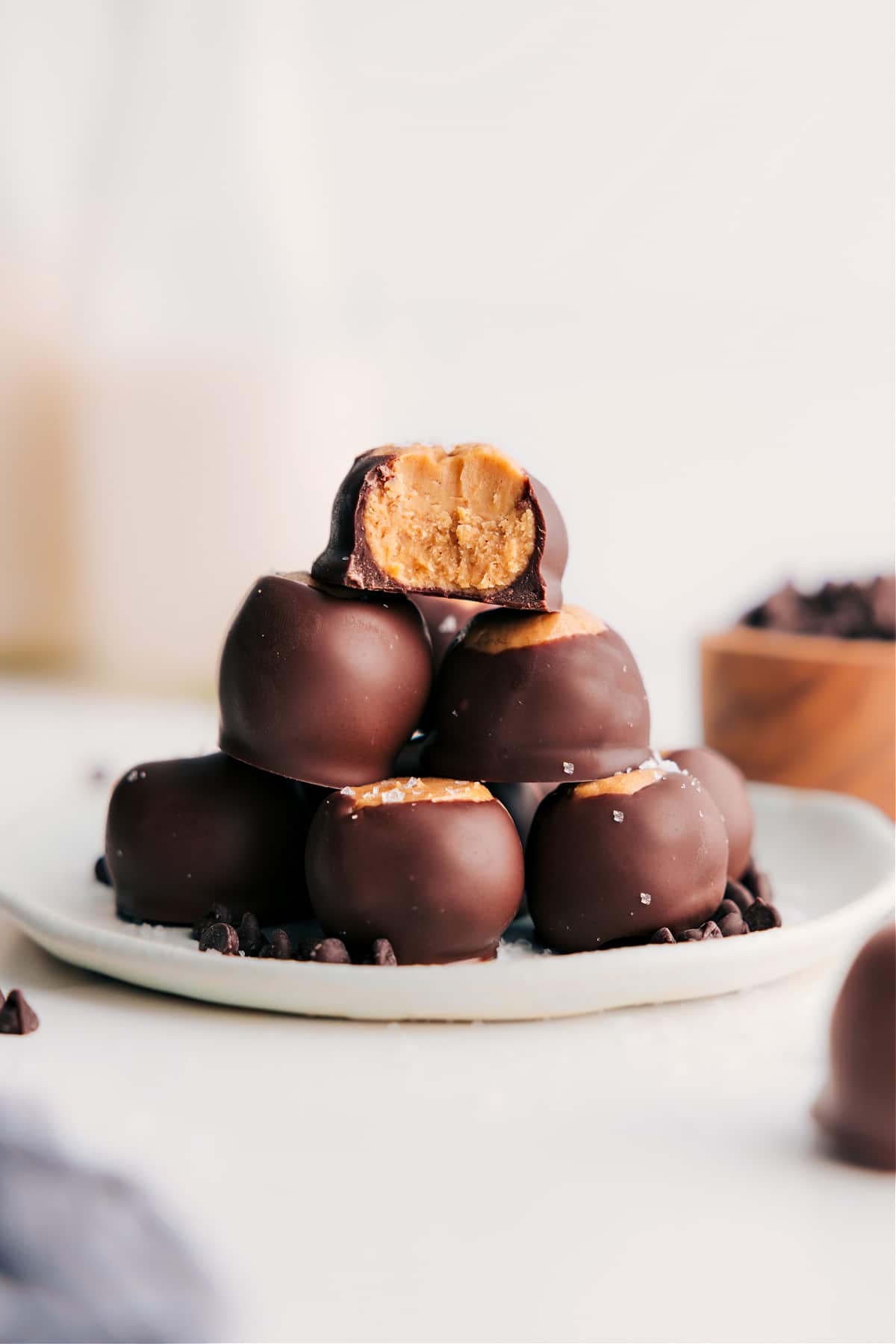 The Perfect Holiday Treat: Buckeye Candy Recipe Buckeye Candy Recipe stacked all together on a plate ready to be enjoyed.