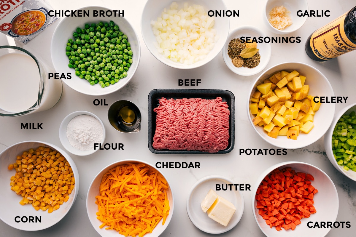 Ingredients In Shepherd's Pie Soup All the ingredients in this recipe prepped out for easy assembly including the chicken broth, peas, milk, corn, flour, oil, onion, seasonings, garlic, veggies, beef, and butter.
