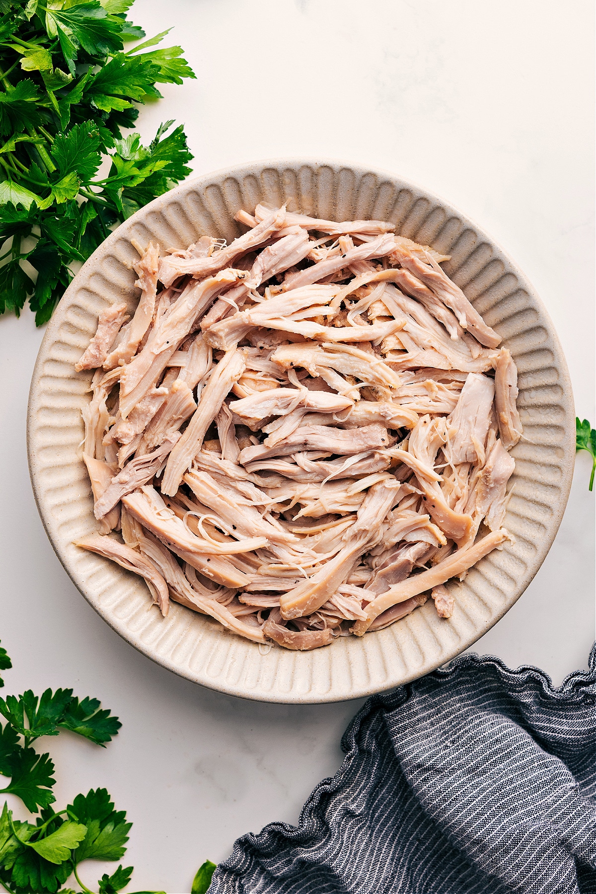 Shredded Chicken Recipes in a bowl ready to be enjoyed or used in another dish.