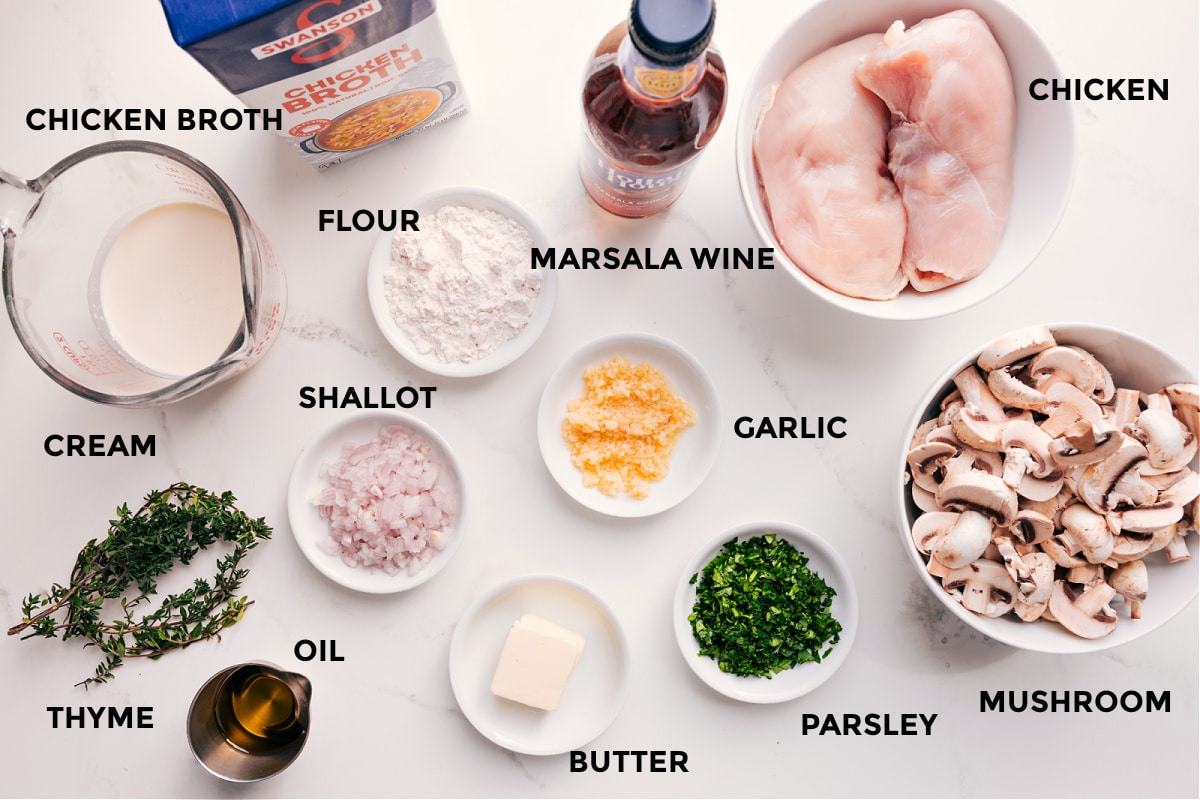 Ingredients In Chicken Marsala Recipe All the ingredients in this recipe prepped out for easy assembly including the cream, chicken broth, thyme, oil, shallot, flour, wine, butter, garlic, parsley, mushrooms, and chicken.